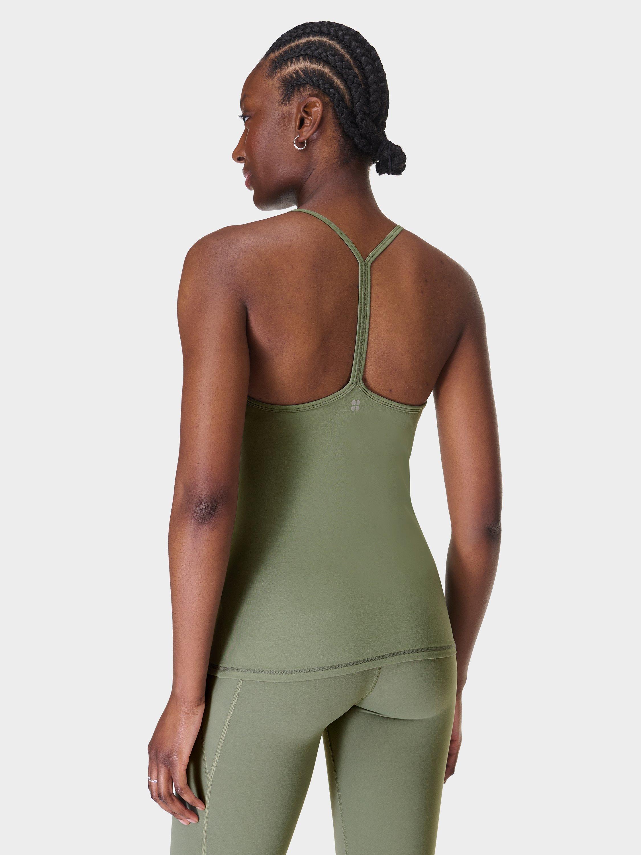Product image 7 of 9, which shows Sweaty Betty Soft Flow 2-in-1 Bra Tank Top, Willow Green, XXS