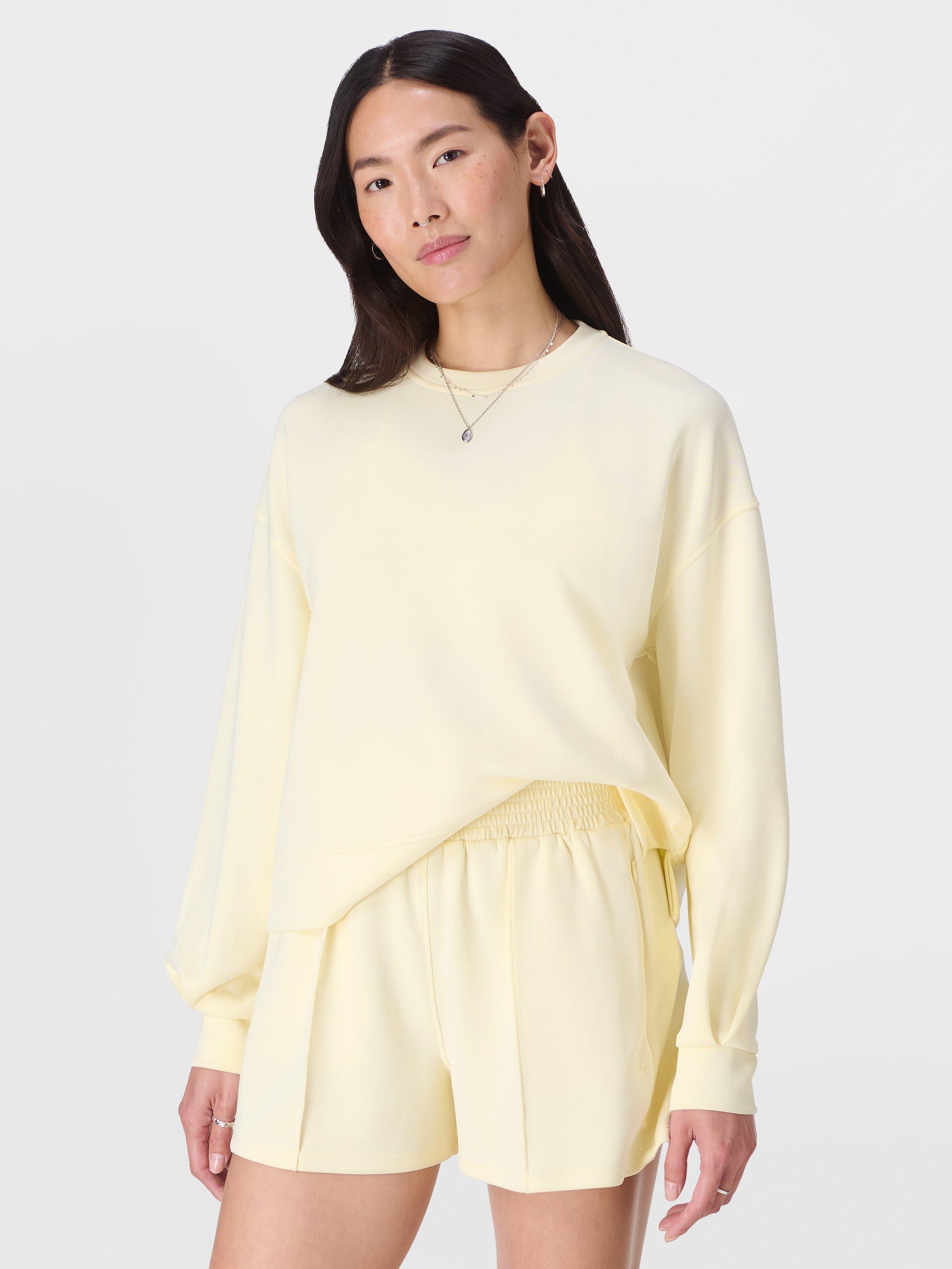 Product image 1 of 6, which shows Sweaty Betty Sand Wash Cloud Weight Sweatshirt, Buttercream Yellow, XXS