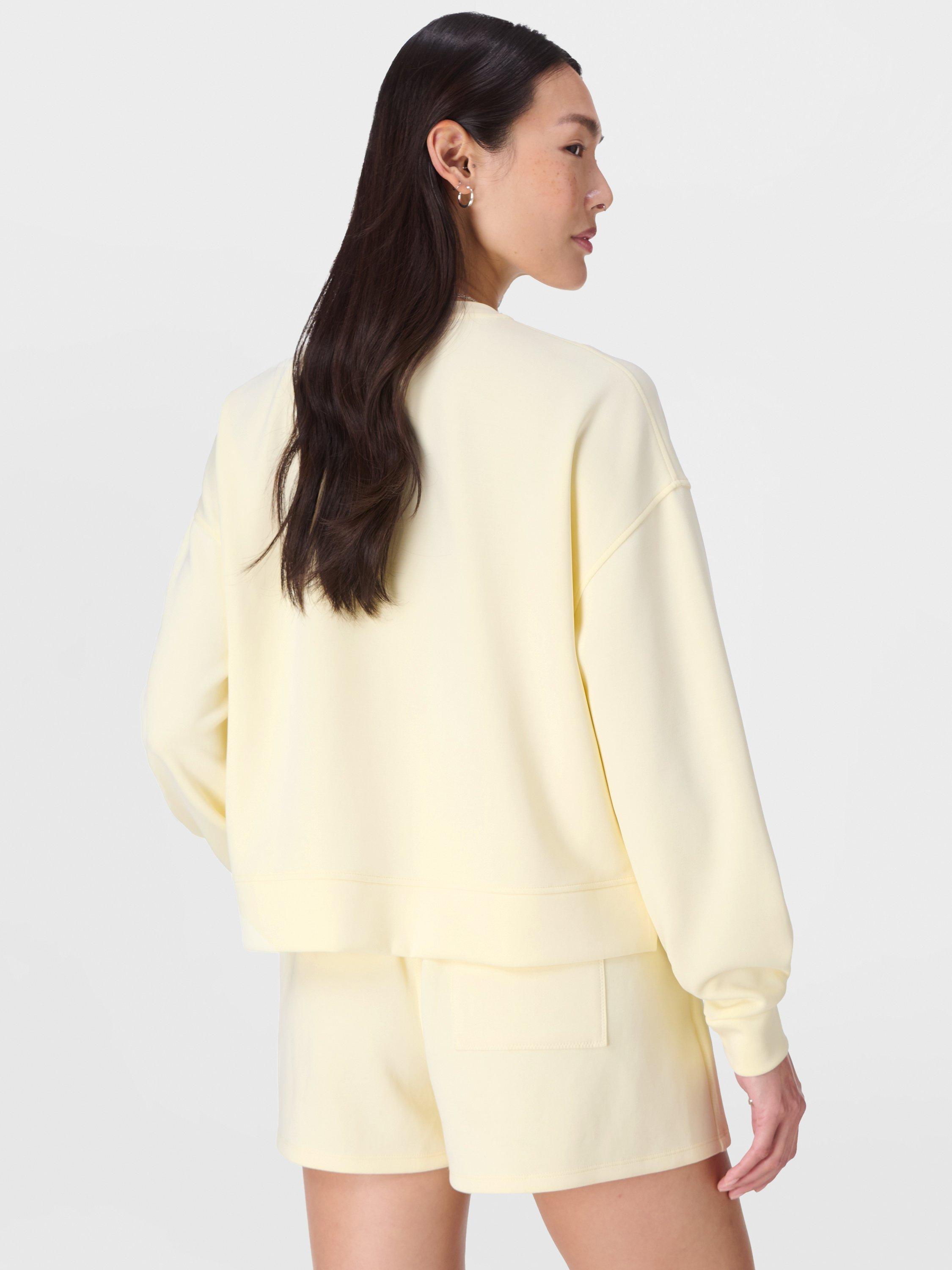 Product image 3 of 6, which shows Sweaty Betty Sand Wash Cloud Weight Sweatshirt, Buttercream Yellow, XXS