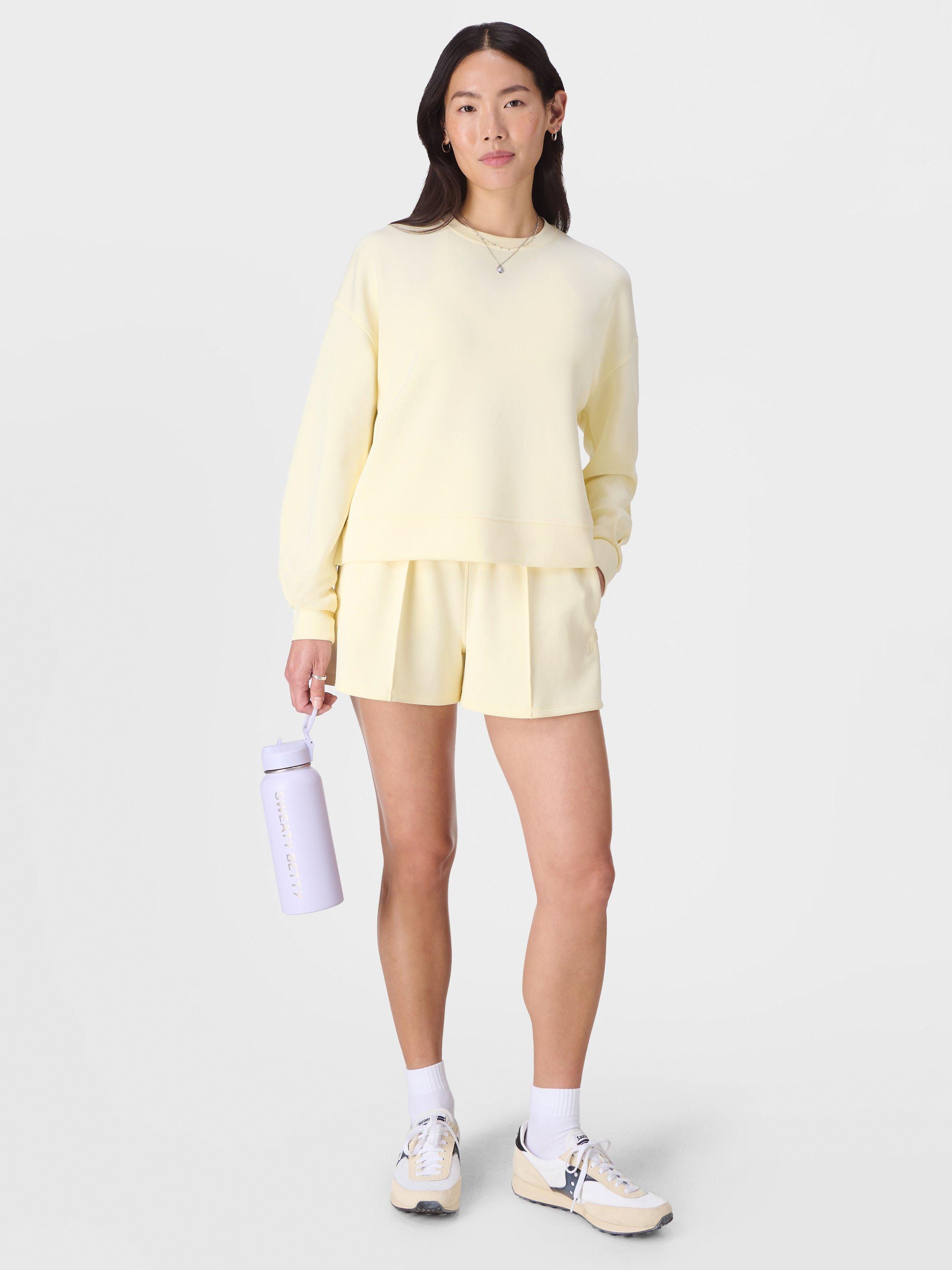 Product image 4 of 6, which shows Sweaty Betty Sand Wash Cloud Weight Sweatshirt, Buttercream Yellow, XXS