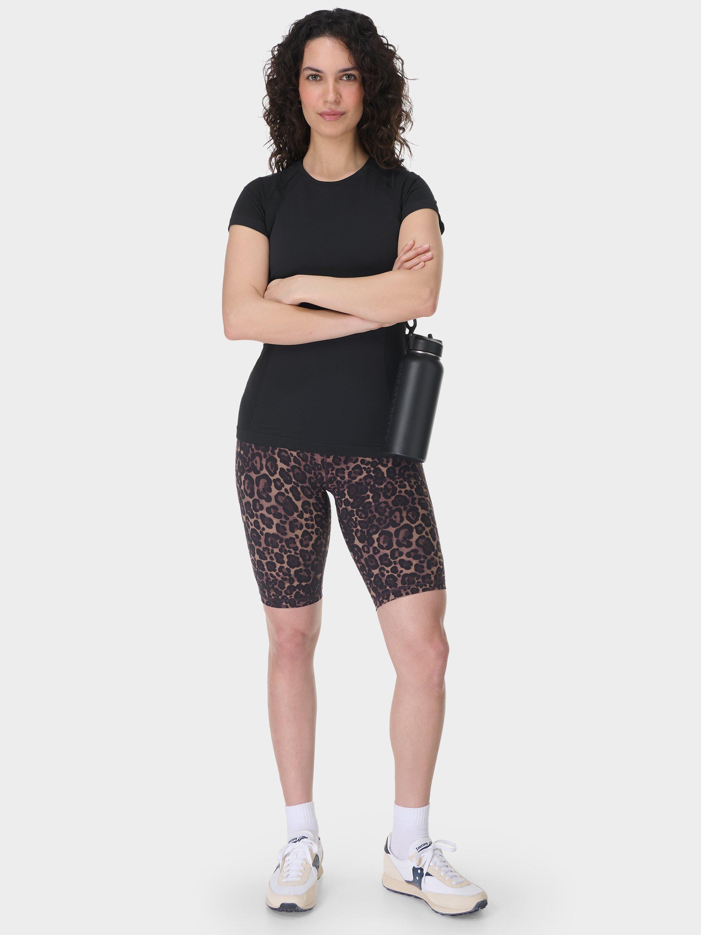 Product image 3 of 8, which shows Sweaty Betty Power 9" Biker Shorts, Brown Wild Leopard Print, XXS