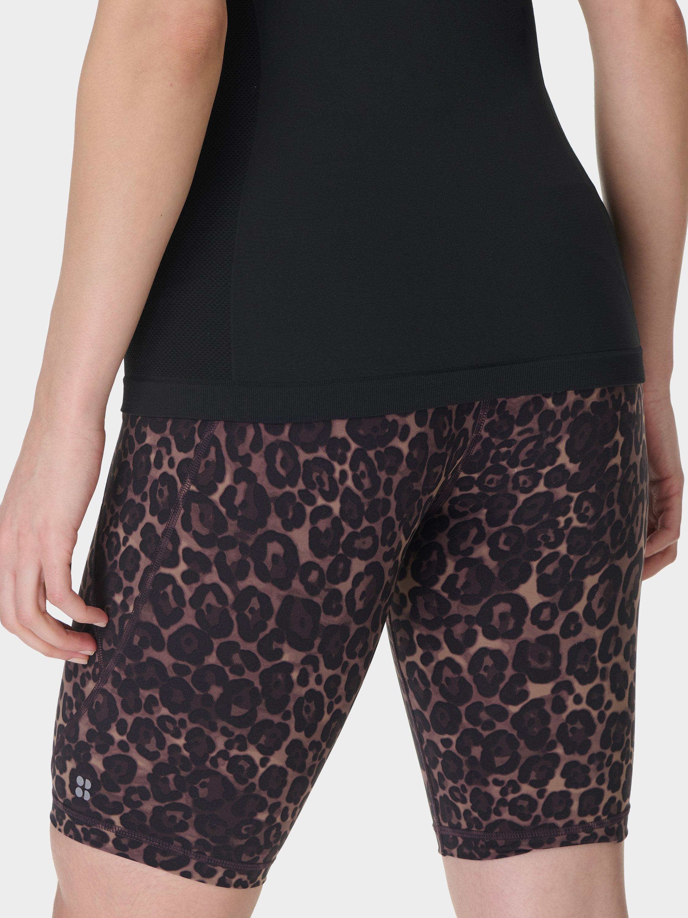 Product image 4 of 8, which shows Sweaty Betty Power 9" Biker Shorts, Brown Wild Leopard Print, XXS