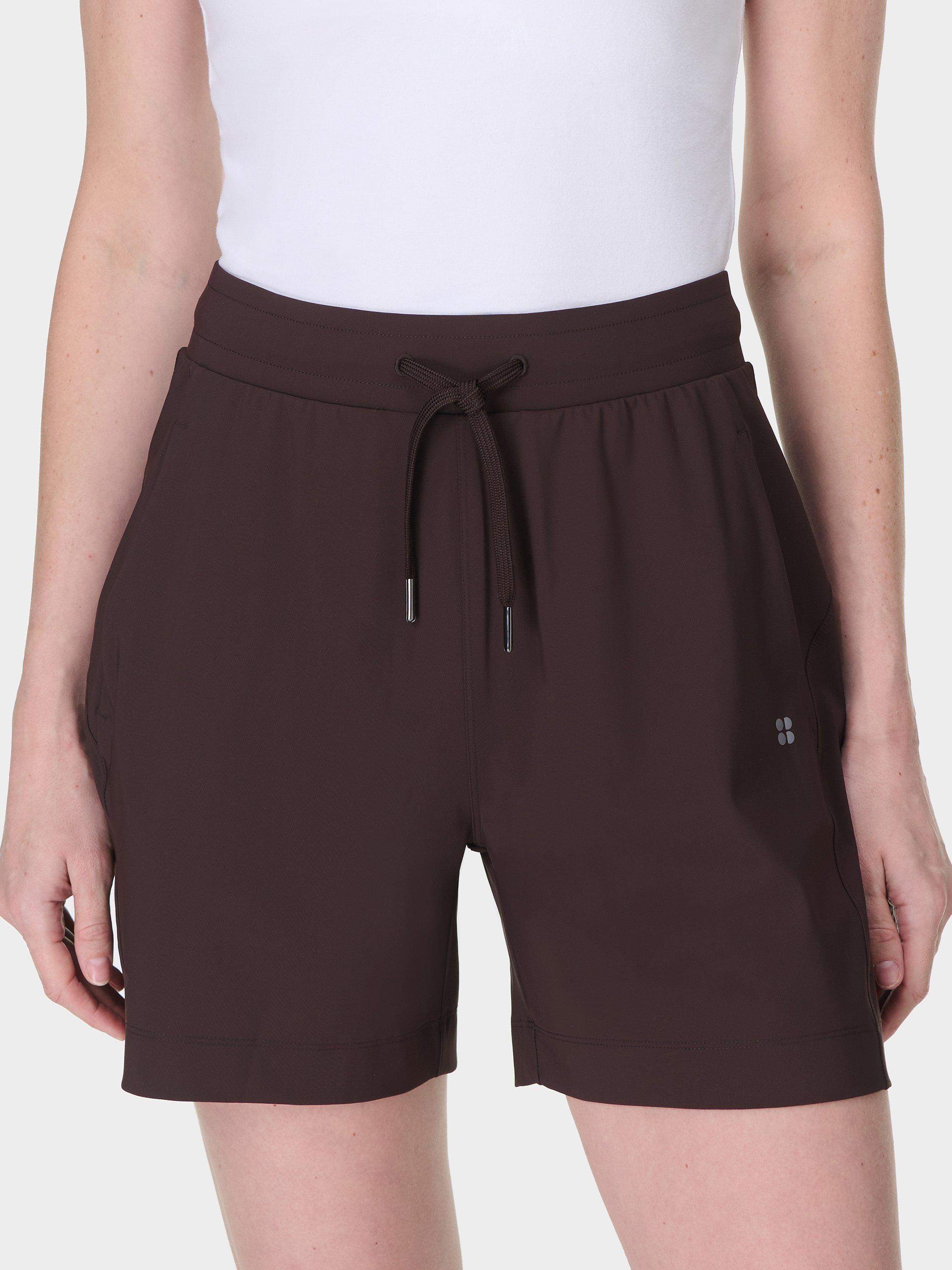 Product image 1 of 6, which shows Sweaty Betty Explorer 5.5" Shorts, Sable Brown, XXS