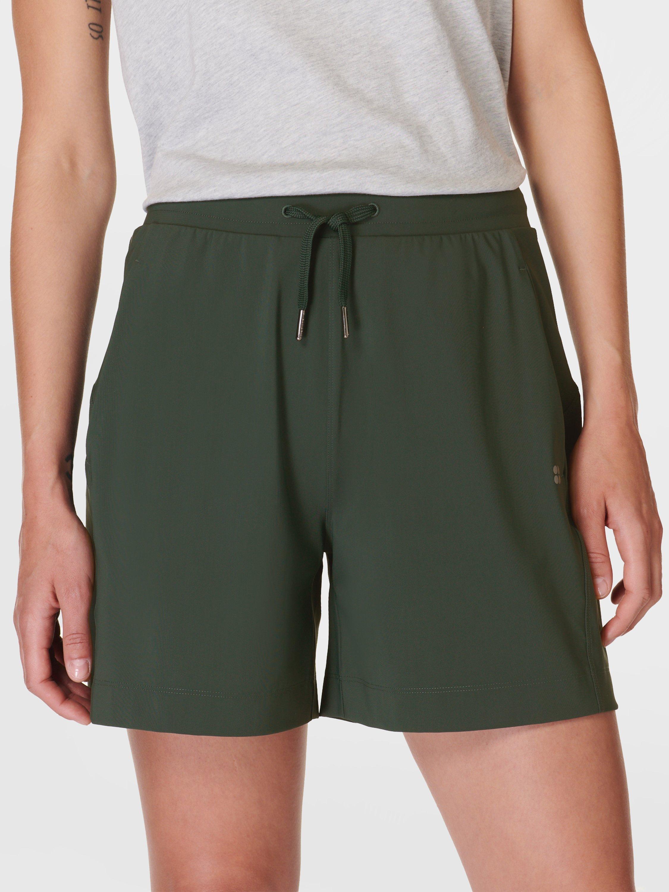 Product image 1 of 8, which shows Sweaty Betty Explorer 5.5" Shorts, Trek Green, XXS