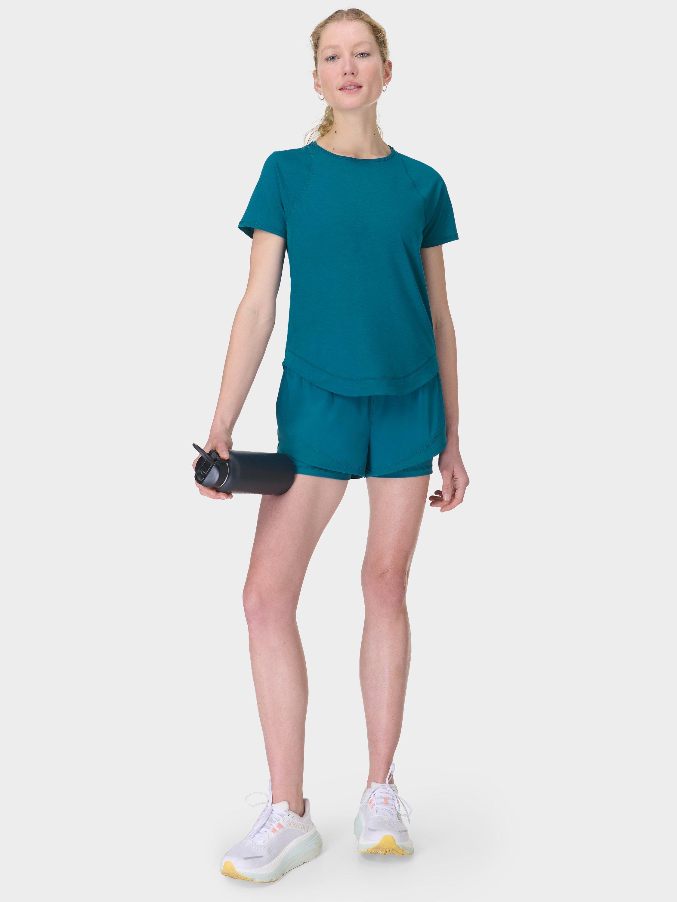 Product image 4 of 8, which shows Sweaty Betty Tempo Run Shorts, Cabin Blue, XXS