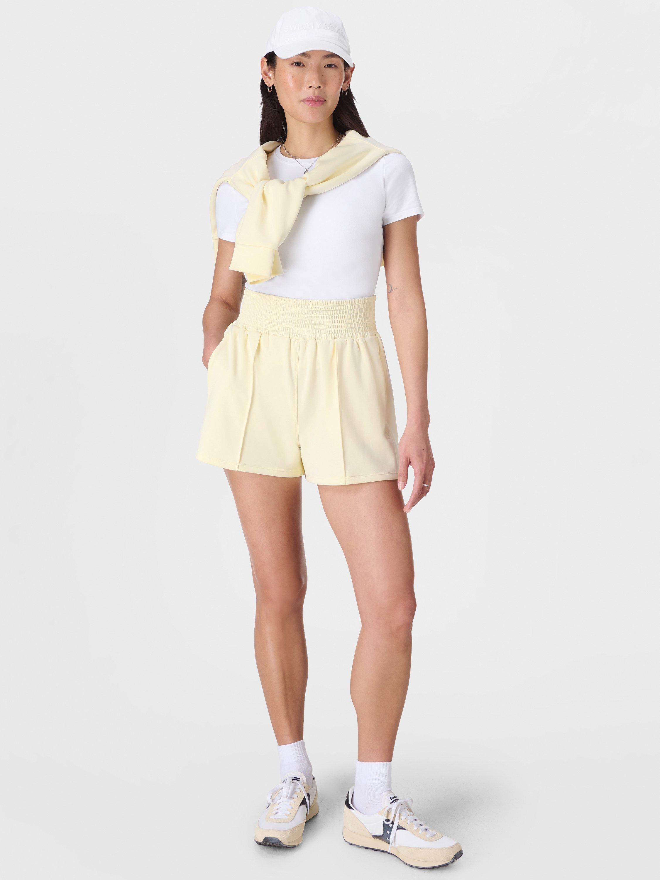 Product image 4 of 8, which shows Sweaty Betty Sand Wash CloudWeight Shorts, Buttercream Yellow, XXS