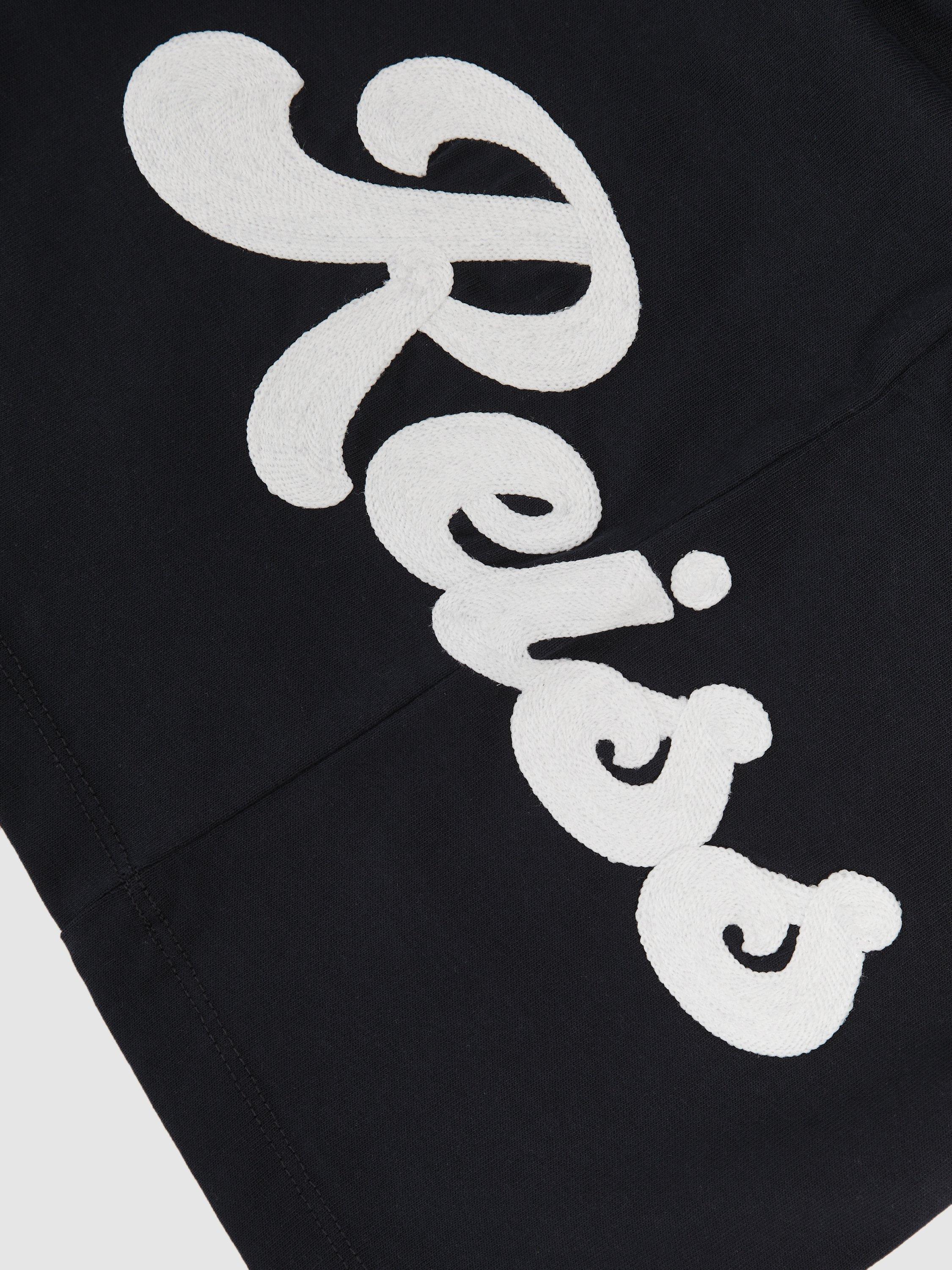 Product image 4 of 4, which shows Reiss Kids' Freddie Logo T-Shirt, Navy, 3-4 years