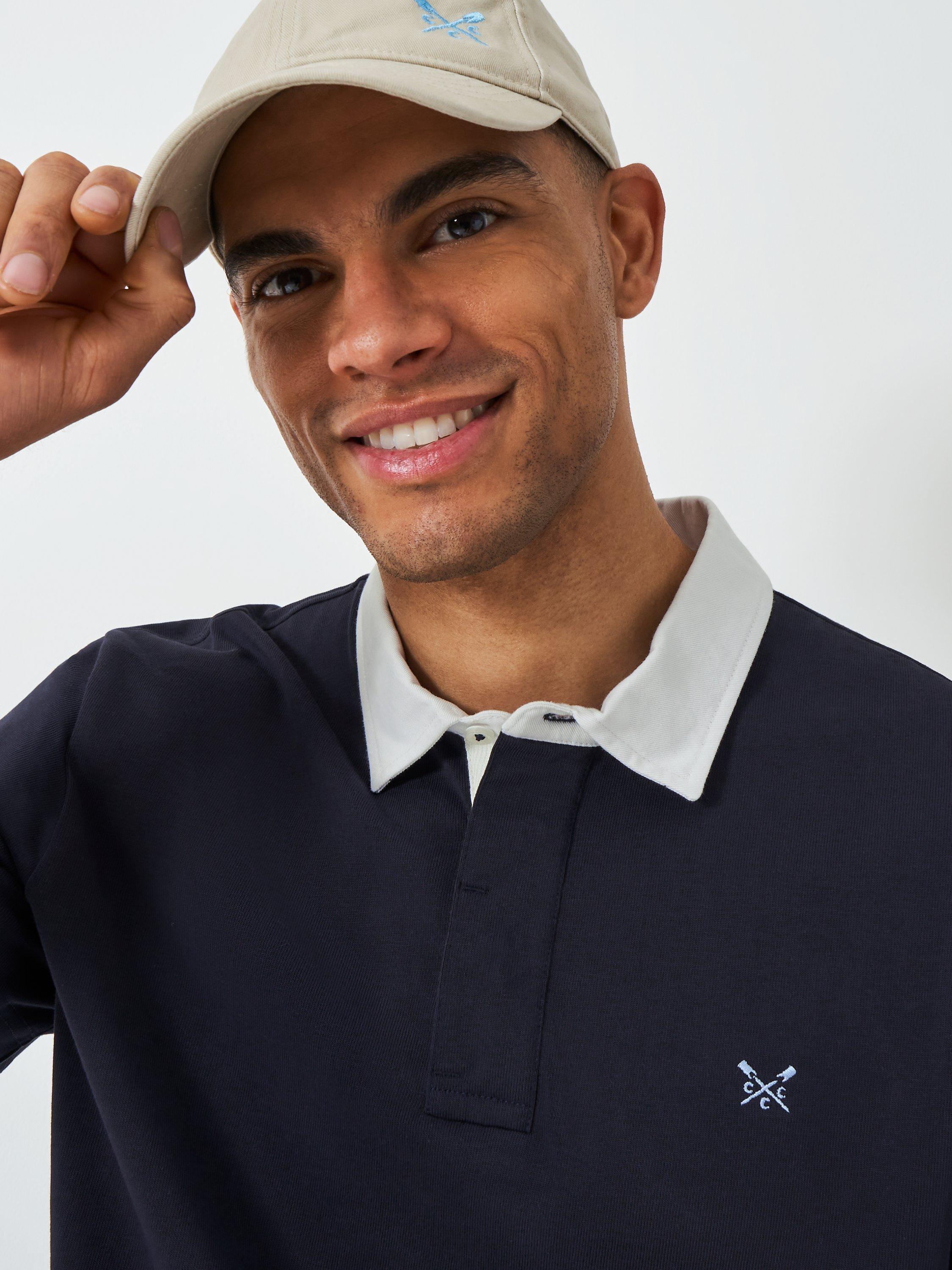 Product image 4 of 6, which shows Crew Clothing Patchwork Short Sleeve Cotton Polo Shirt, Navy Blue, L