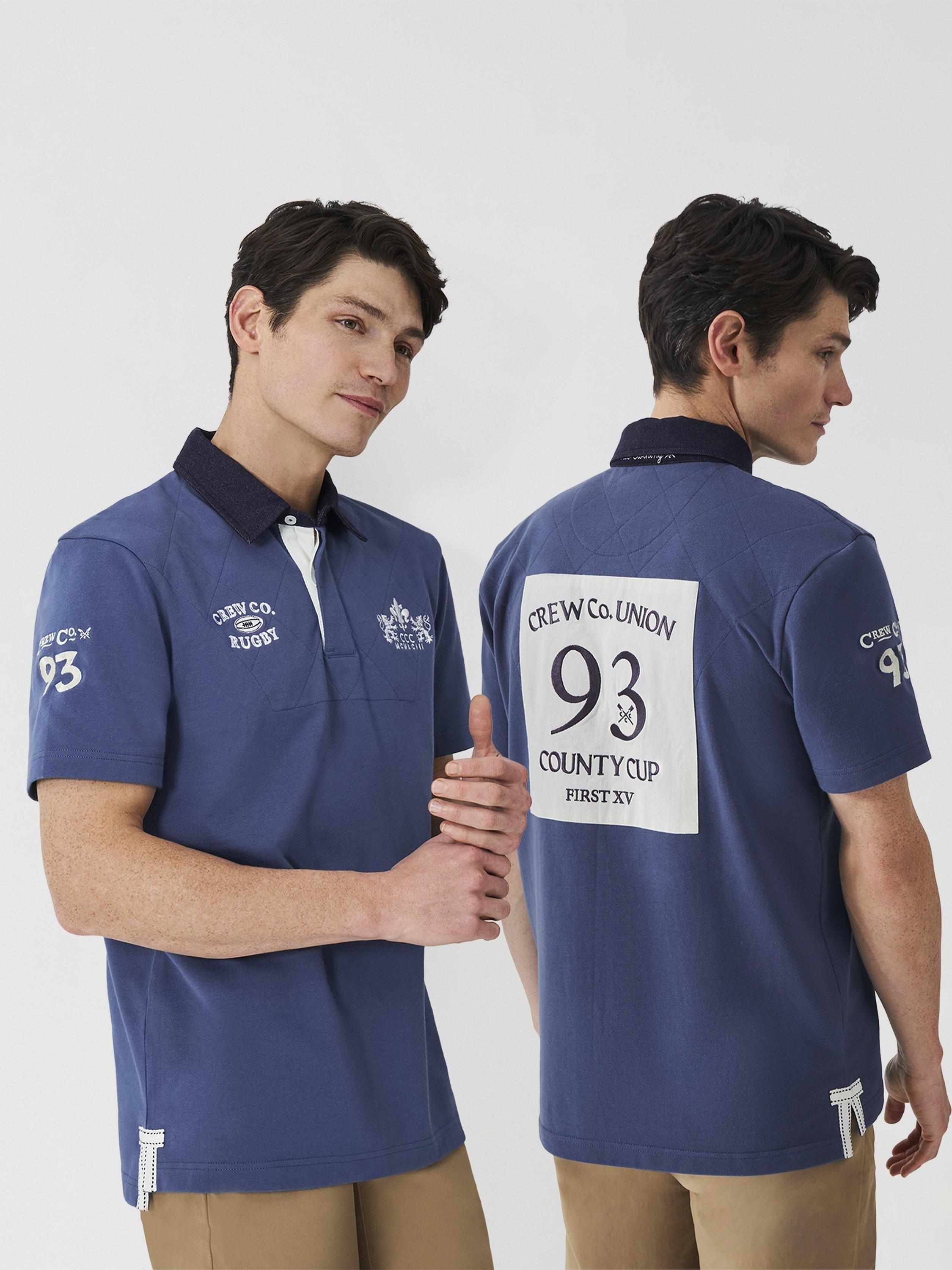 Product image 3 of 6, which shows Crew Clothing Patchwork Short Sleeve Cotton Polo Shirt, Dark Blue, L