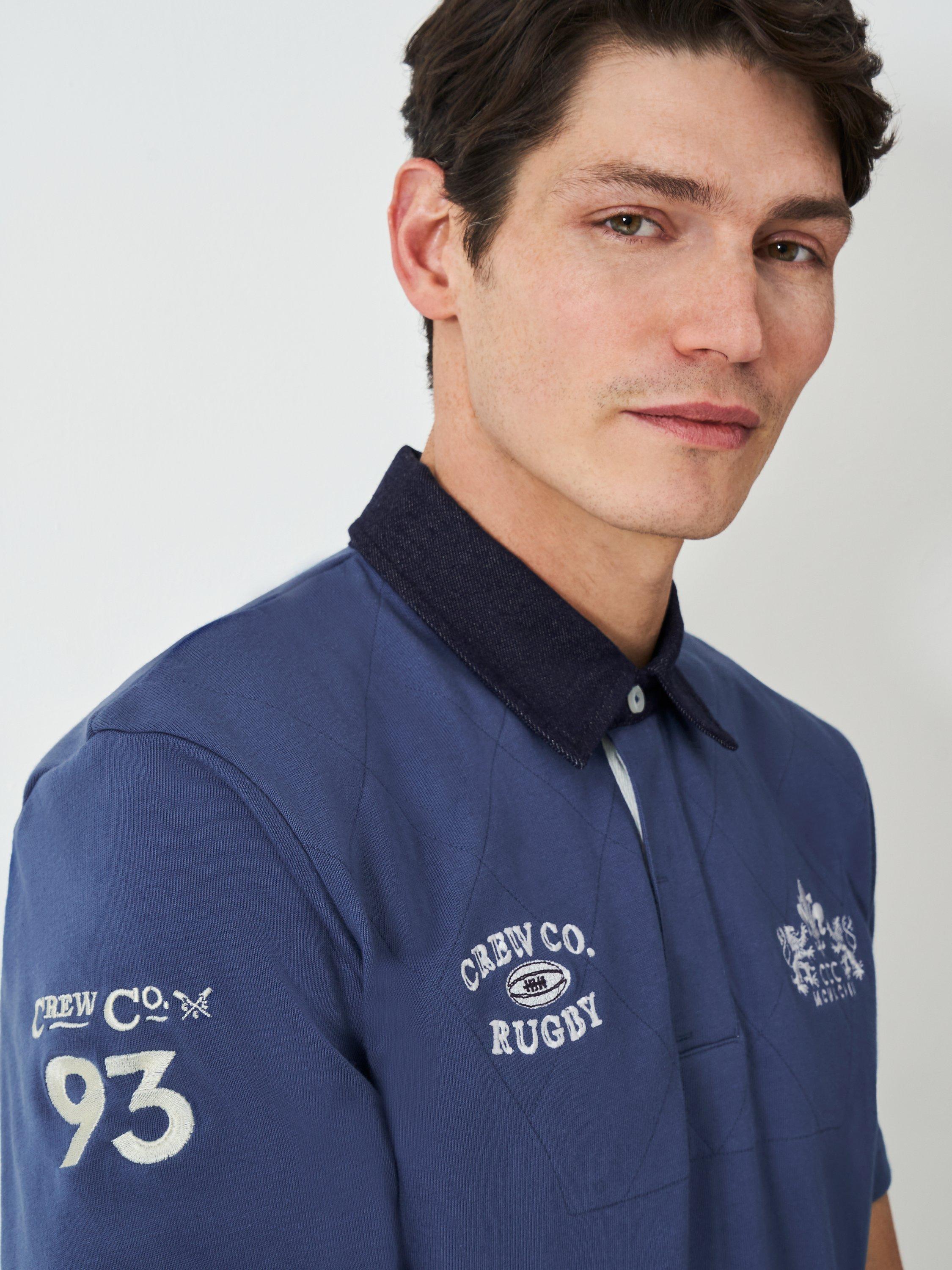 Product image 5 of 6, which shows Crew Clothing Patchwork Short Sleeve Cotton Polo Shirt, Dark Blue, L