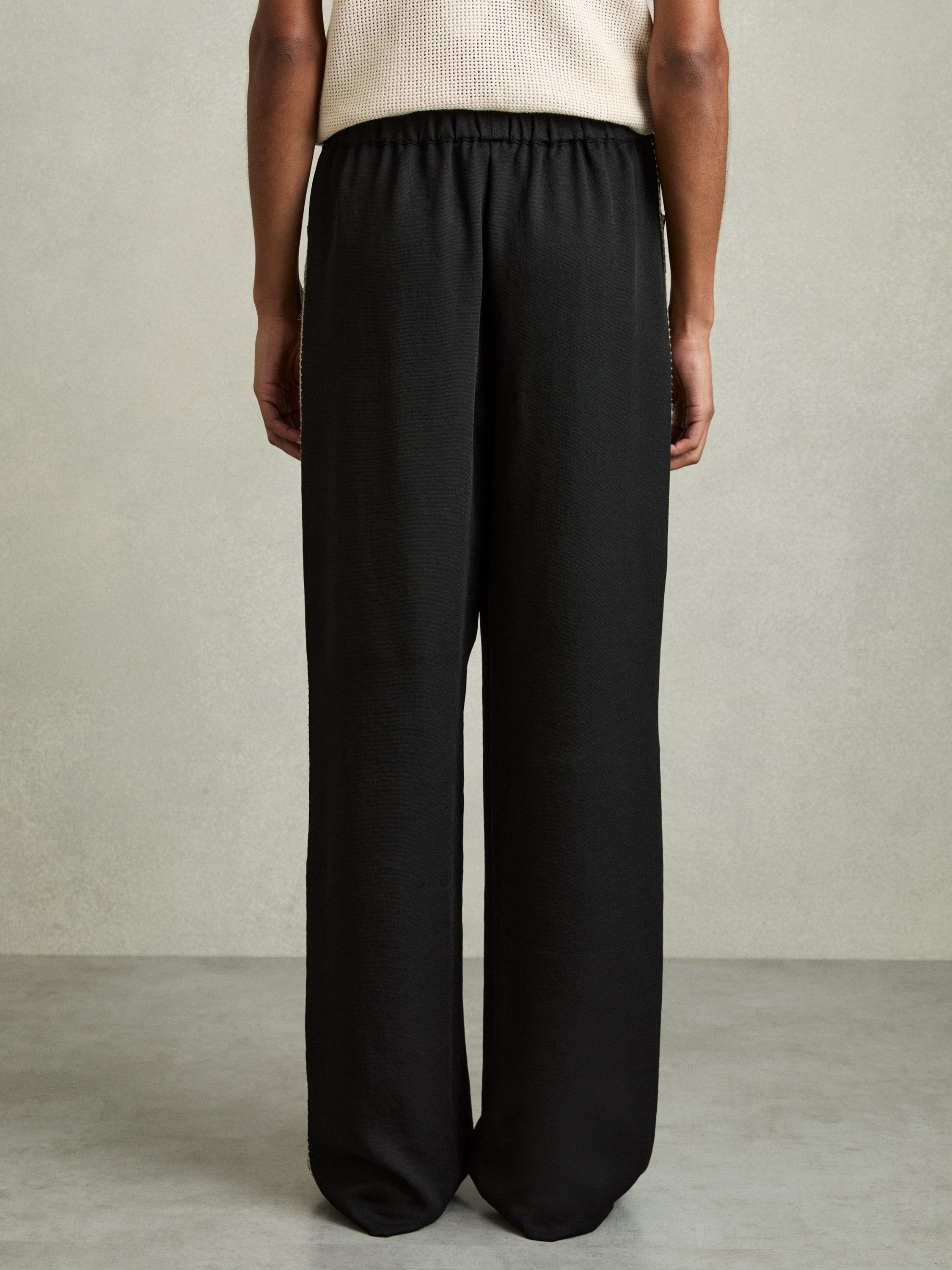 Product image 2 of 5, which shows Reiss Petite Inaya Stripe Wide Leg Trousers, Black, 6Pt