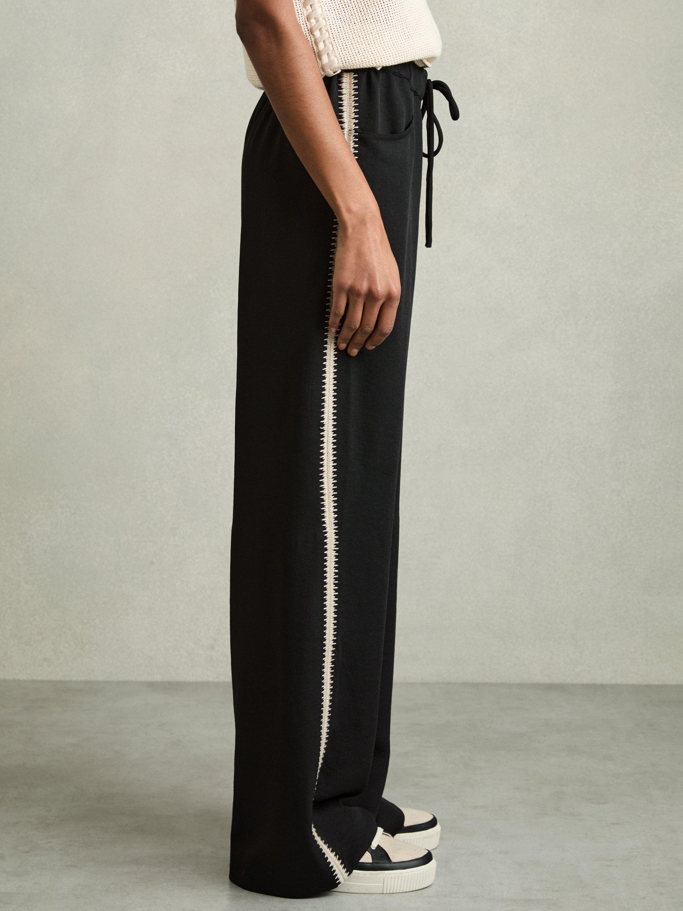 Product image 4 of 5, which shows Reiss Petite Inaya Stripe Wide Leg Trousers, Black, 6Pt