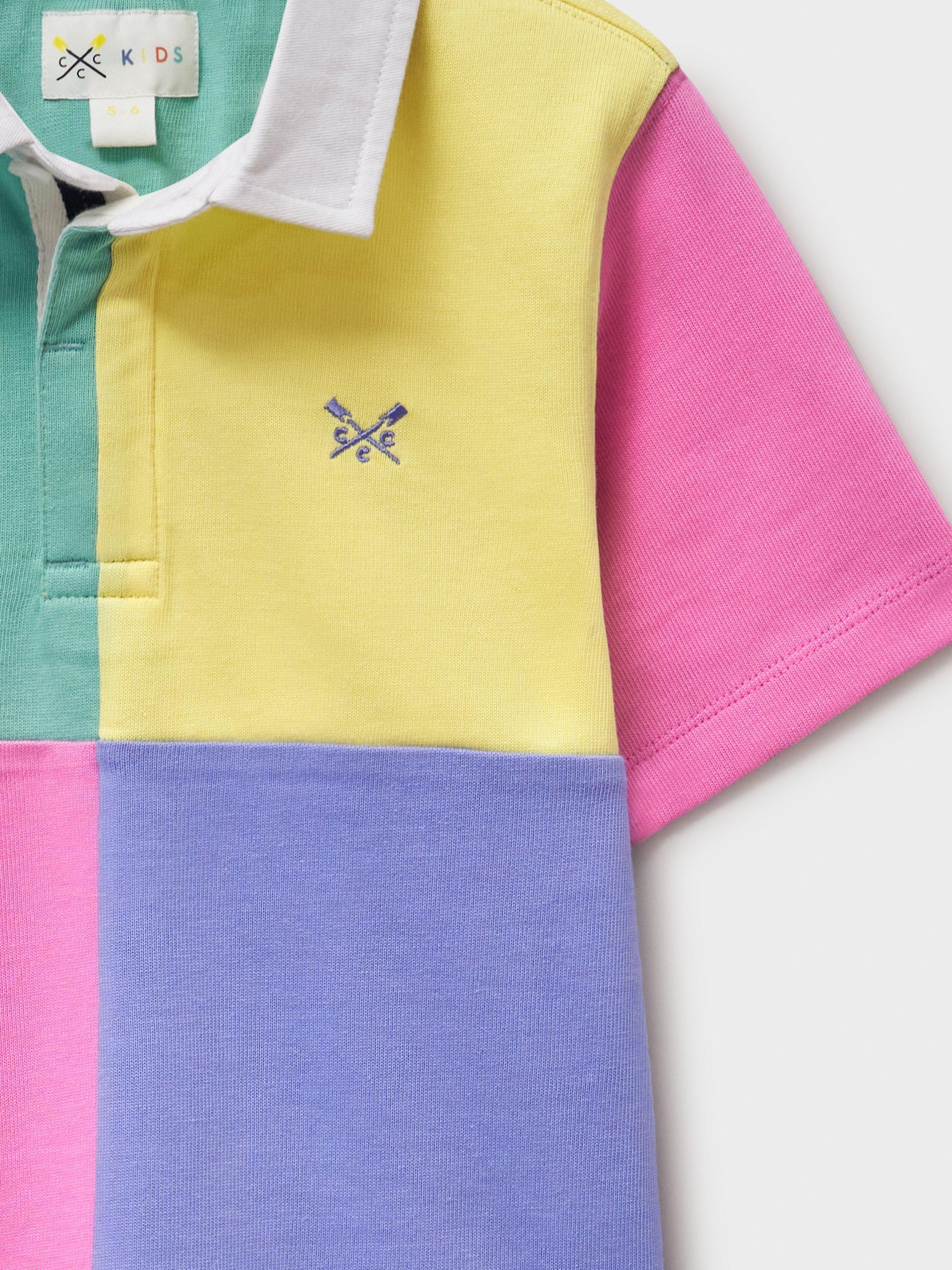 Product image 4 of 5, which shows Crew Clothing Kids' Cotton Short Sleeved Harlequin Rugby Shirt, Multi/Pink, 8-9 years