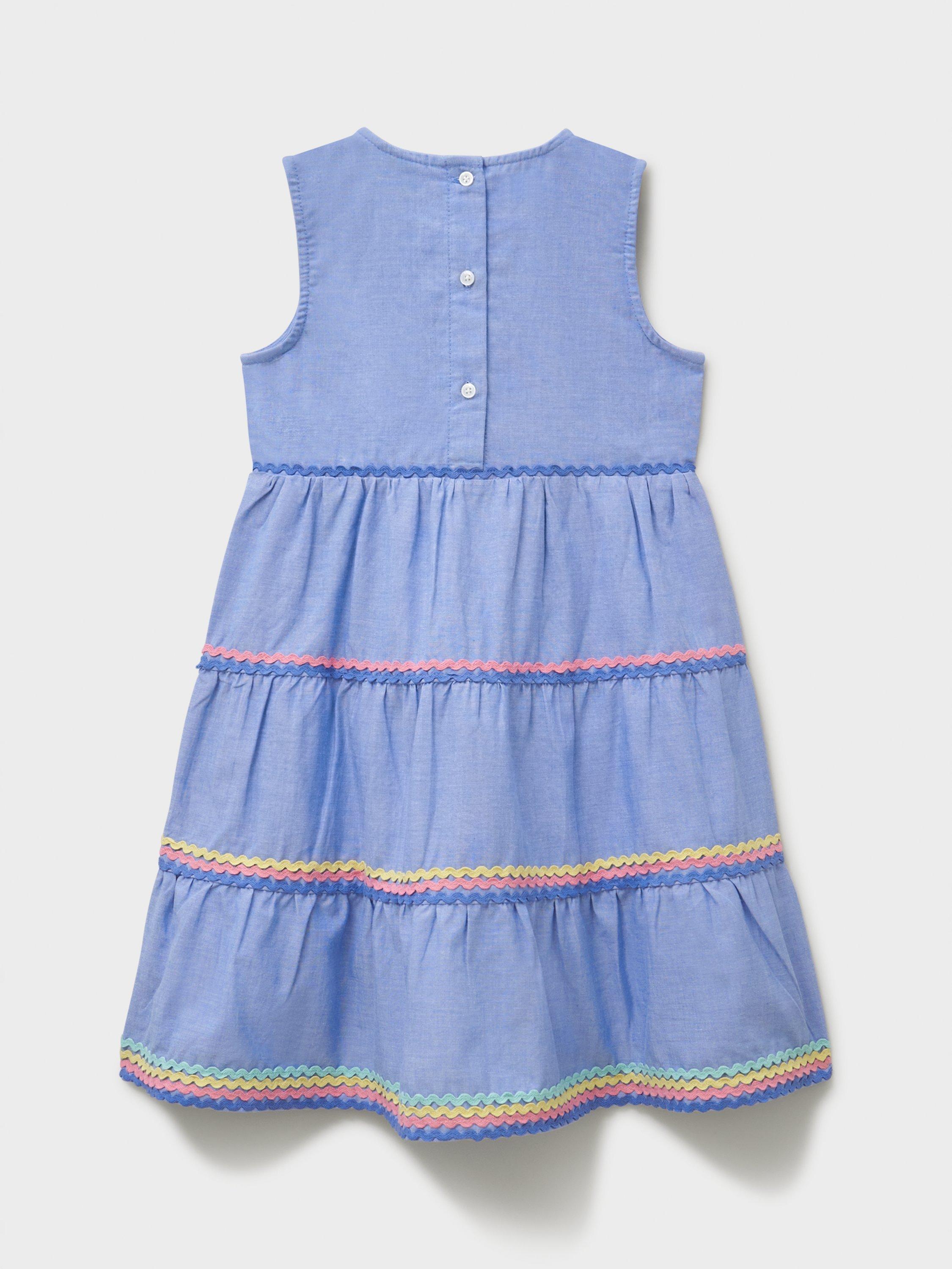 Product image 2 of 3, which shows Crew Clothing Kids' Chabray Sleeveless Ric-Rac Midi Dress, Mid Blue, 8-9 years