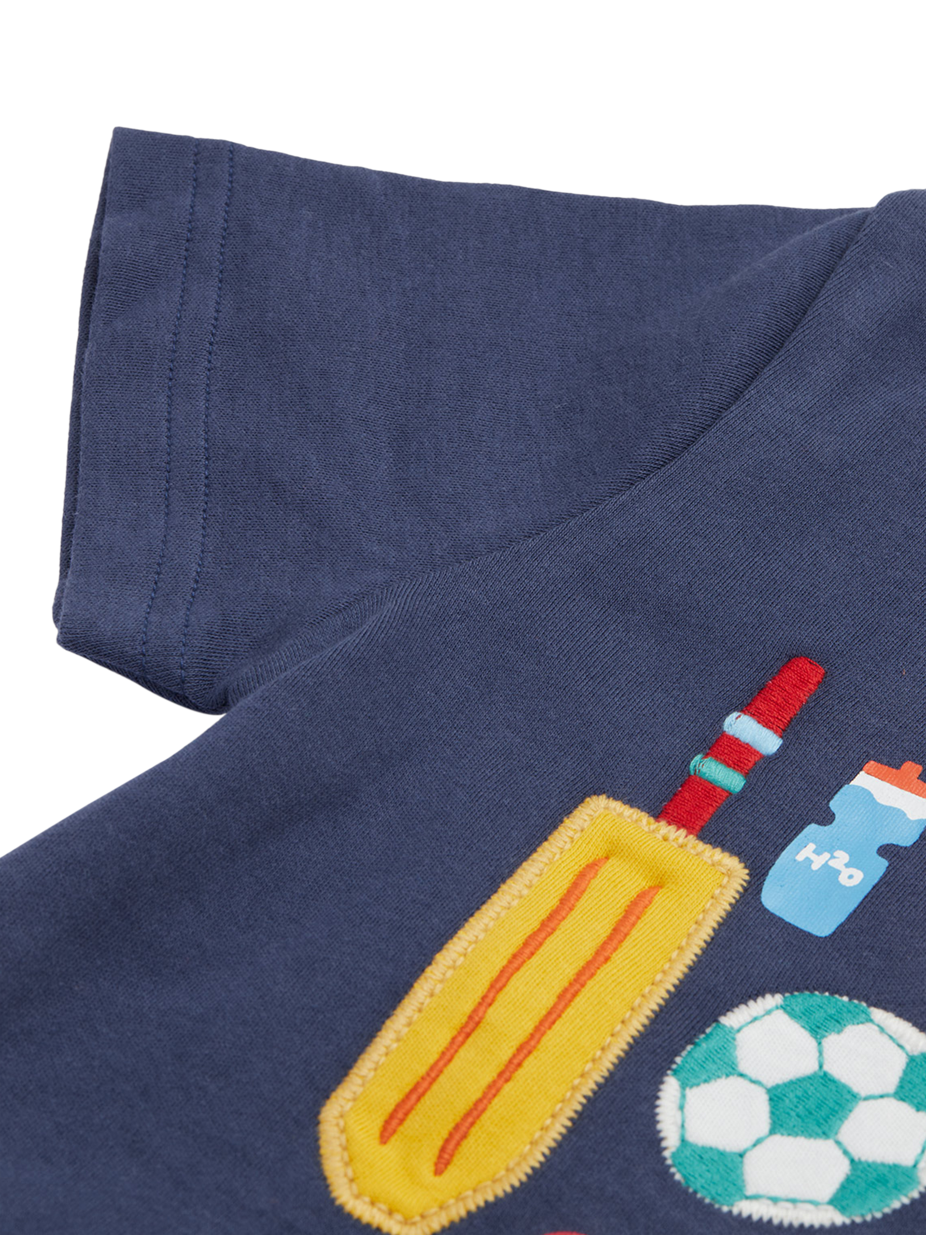 Product image 3 of 4, which shows Frugi Kids' Carsen Organic Cotton Sports Applique T-Shirt, Navy/Multi, 2-3 years