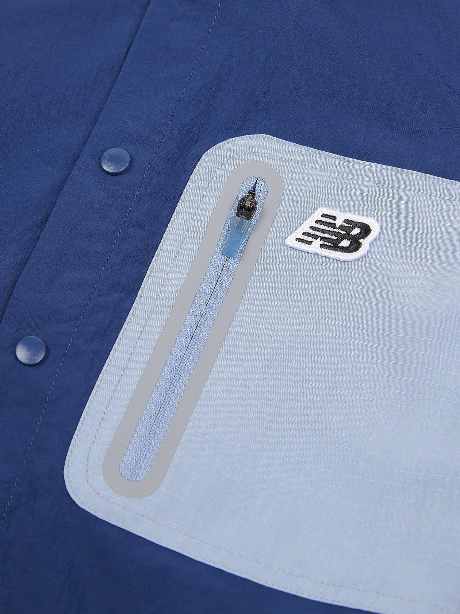 Product image 6 of 10, which shows New Balance Kids' Premium Colour Block Logo Shirt, Navy, 7-8 years