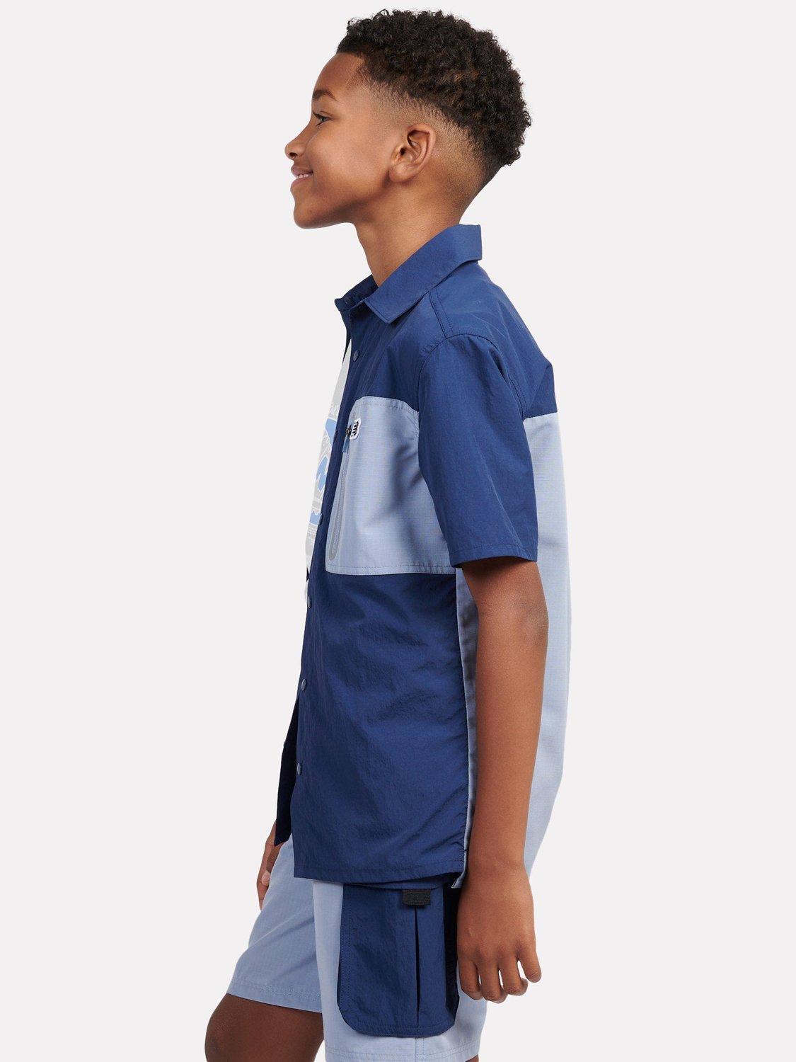 Product image 9 of 10, which shows New Balance Kids' Premium Colour Block Logo Shirt, Navy, 7-8 years