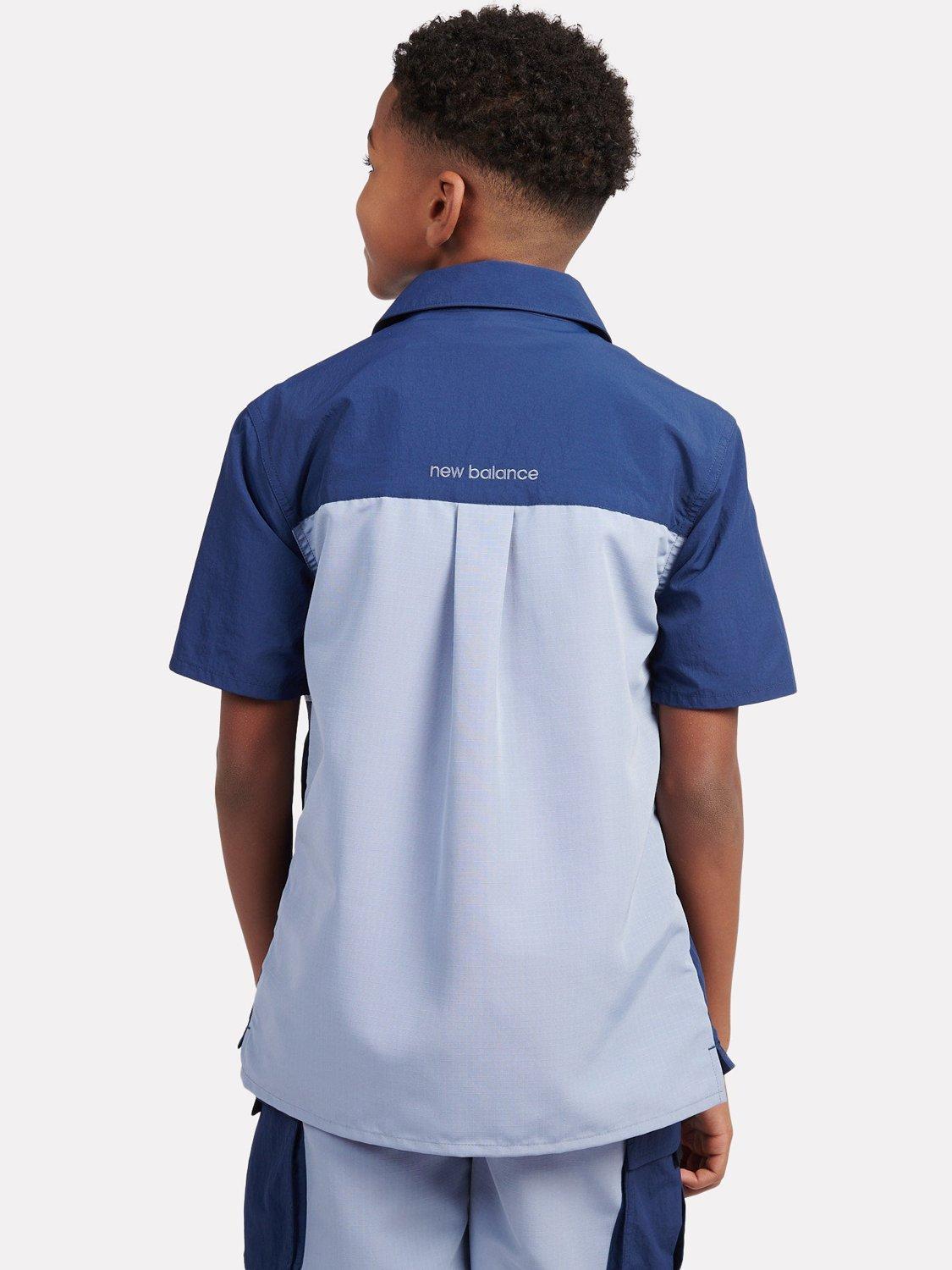 Product image 10 of 10, which shows New Balance Kids' Premium Colour Block Logo Shirt, Navy, 7-8 years