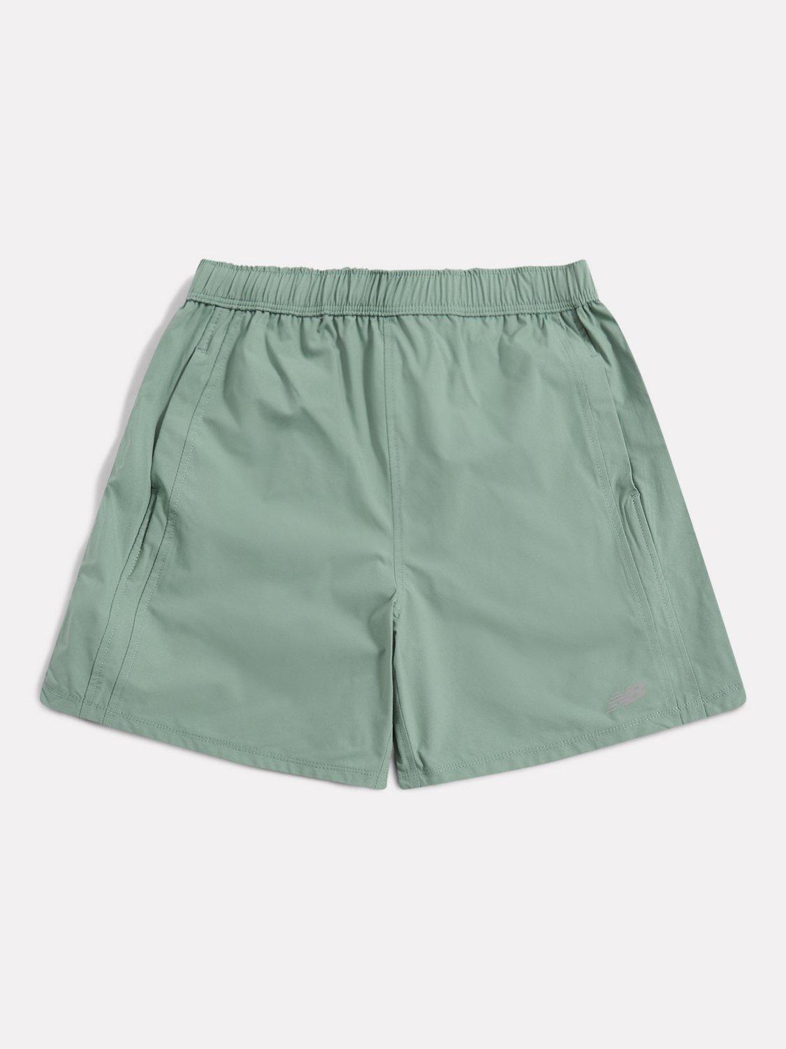 Product image 1 of 4, which shows New Balance Kids' Athletics Shorts, Dark Juniper, 7-8 years