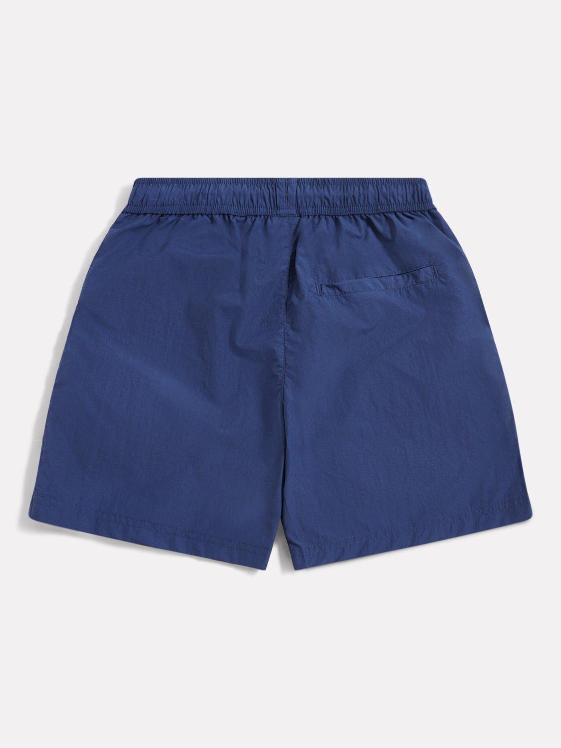 Product image 2 of 3, which shows New Balance Kids' Varsity Woven Shorts, Navy, 7-8 years