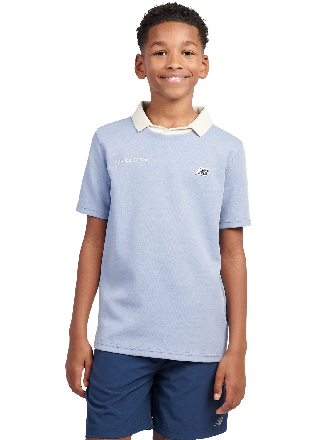 Product image 1 of 9, which shows New Balance Kids' Badge Logo Polo Shirt, Dusk Shower, 7-8 years