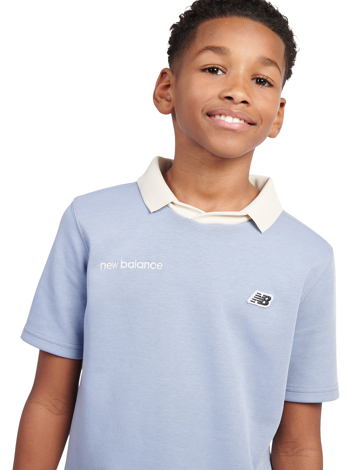 Product image 4 of 9, which shows New Balance Kids' Badge Logo Polo Shirt, Dusk Shower, 7-8 years