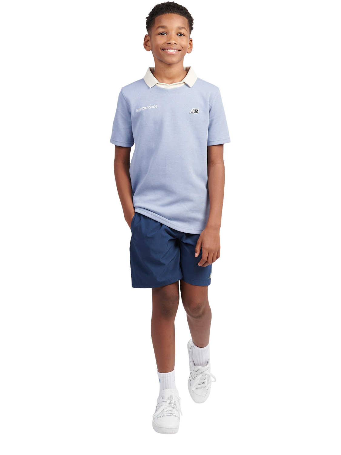 Product image 5 of 9, which shows New Balance Kids' Badge Logo Polo Shirt, Dusk Shower, 7-8 years