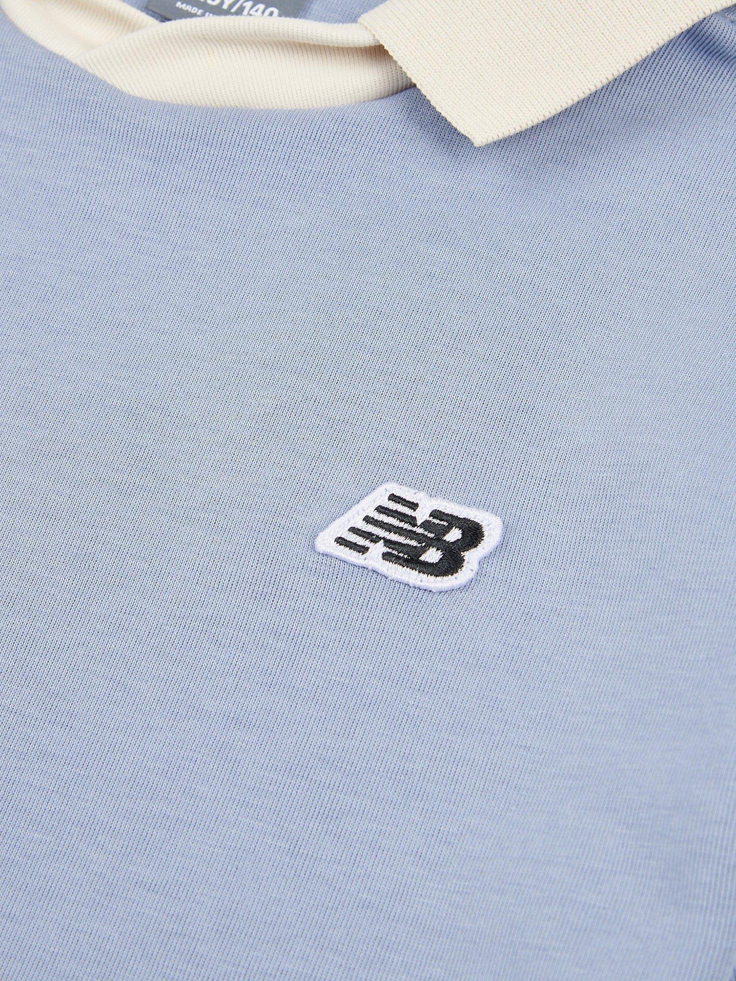 Product image 8 of 9, which shows New Balance Kids' Badge Logo Polo Shirt, Dusk Shower, 7-8 years
