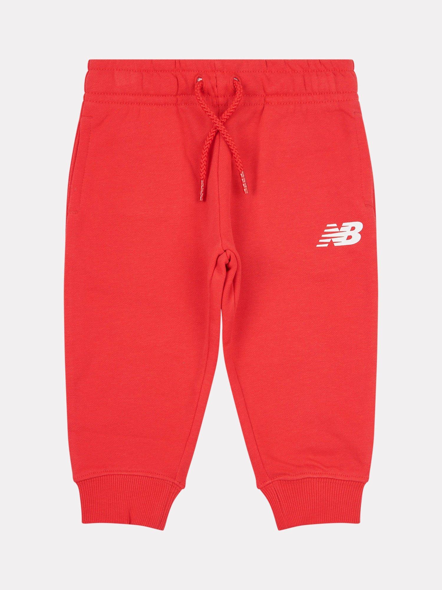 Product image 1 of 3, which shows New Balance Kids' Cotton Relaxed Drawstring Joggers, True Red, 12 months