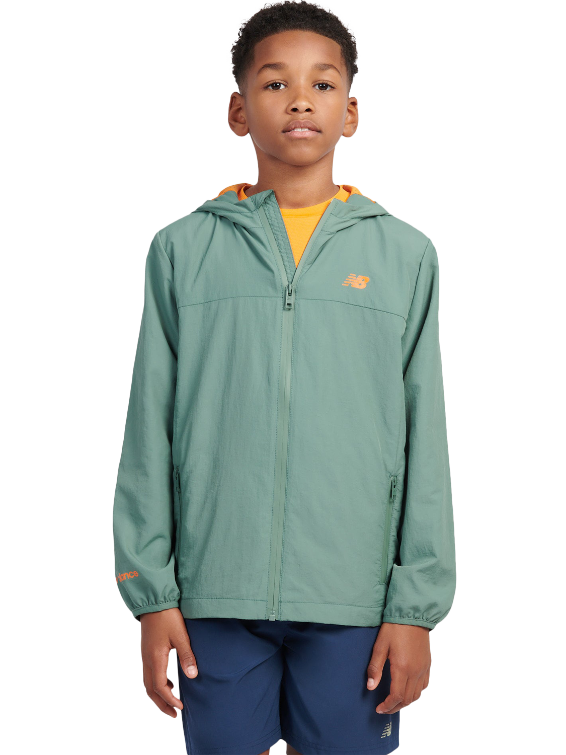 Product image 1 of 10, which shows New Balance Kids' Water Resistant Light Weight Jacket, Dark Juniper, 7-8 years