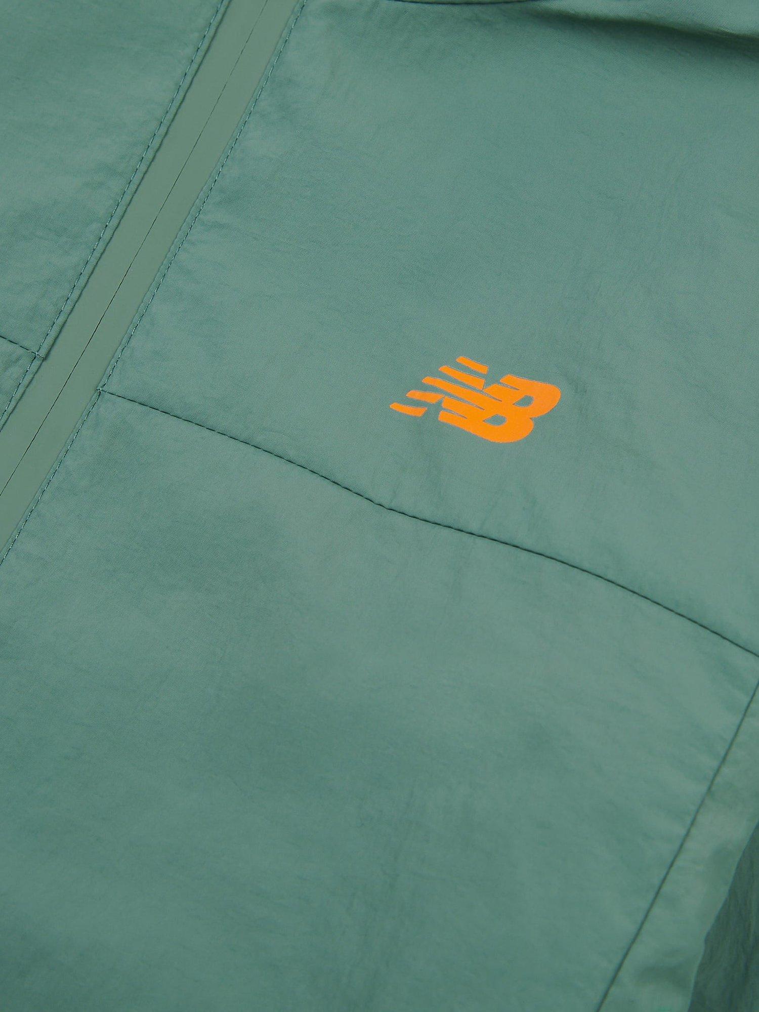 Product image 9 of 10, which shows New Balance Kids' Water Resistant Light Weight Jacket, Dark Juniper, 7-8 years