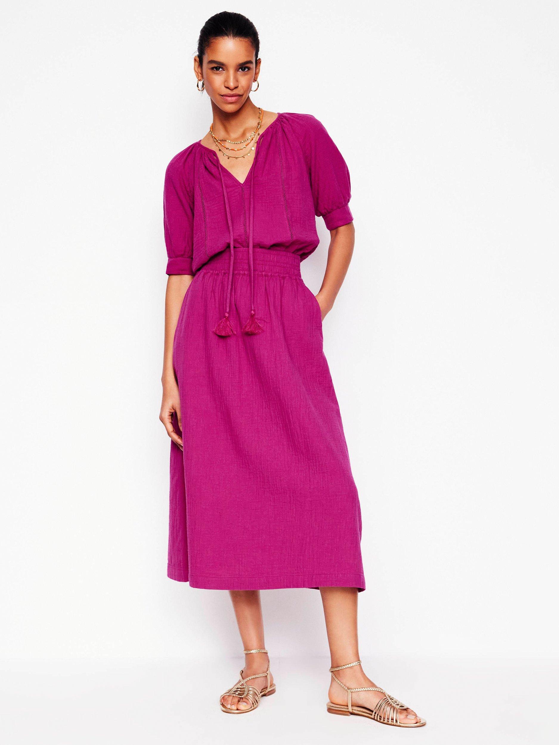 Product image 1 of 5, which shows Boden Cotton Doublecloth Smocked Midi Skirt, Fuchsia, 8