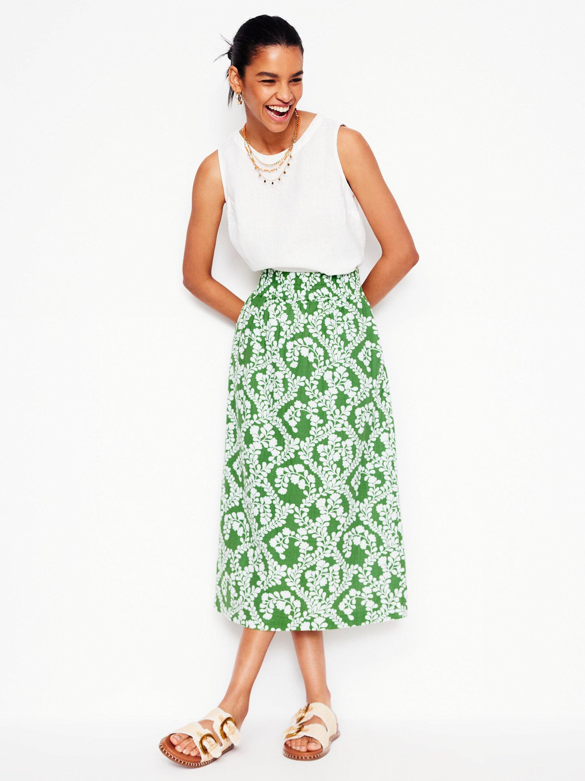 Product image 1 of 5, which shows Boden Cotton Doublecloth Floral Print Smocked Midi Skirt, Green/Multi, 12