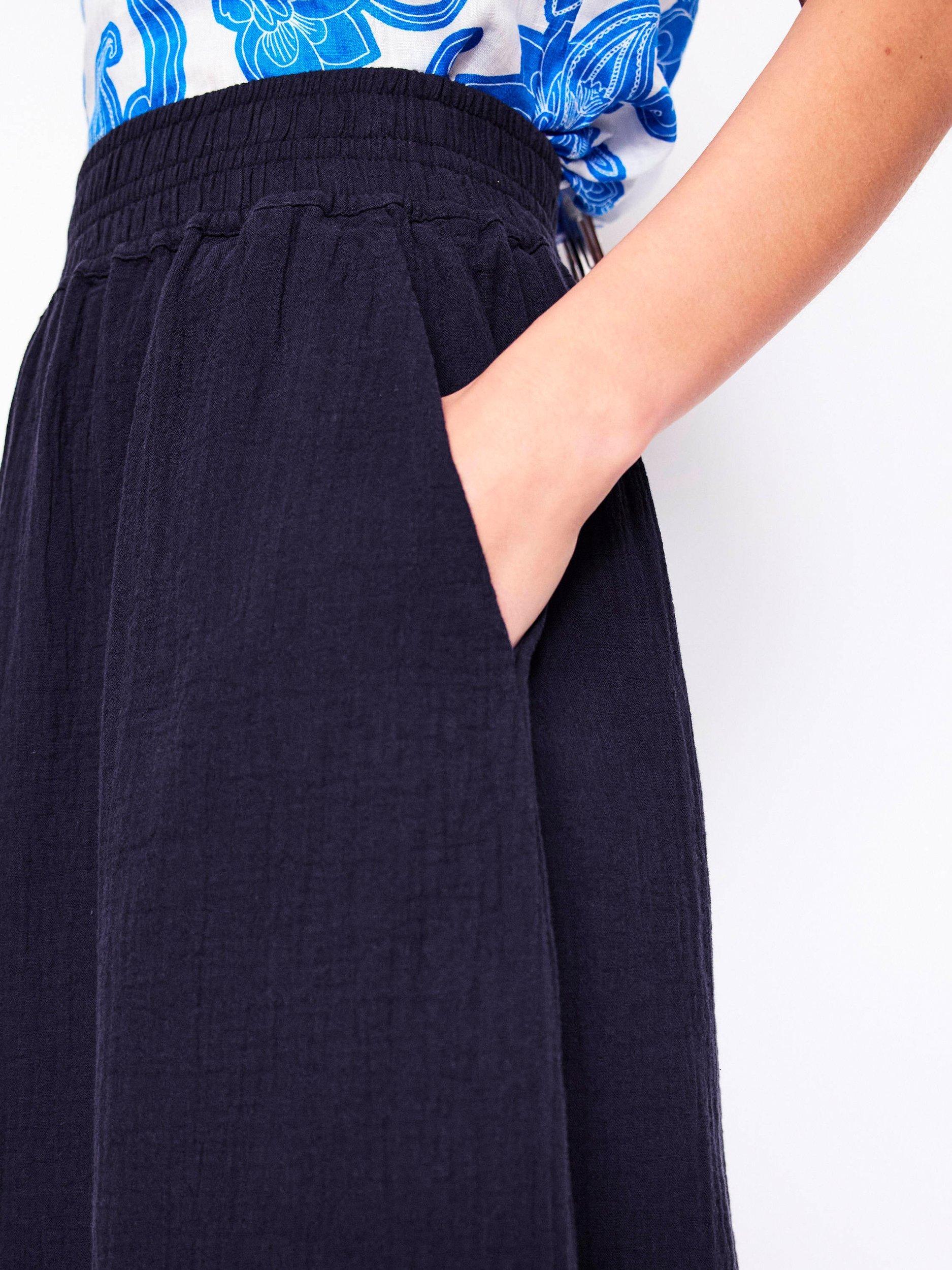 Product image 2 of 5, which shows Boden Cotton Doublecloth Smocked Midi Skirt, Navy, 8