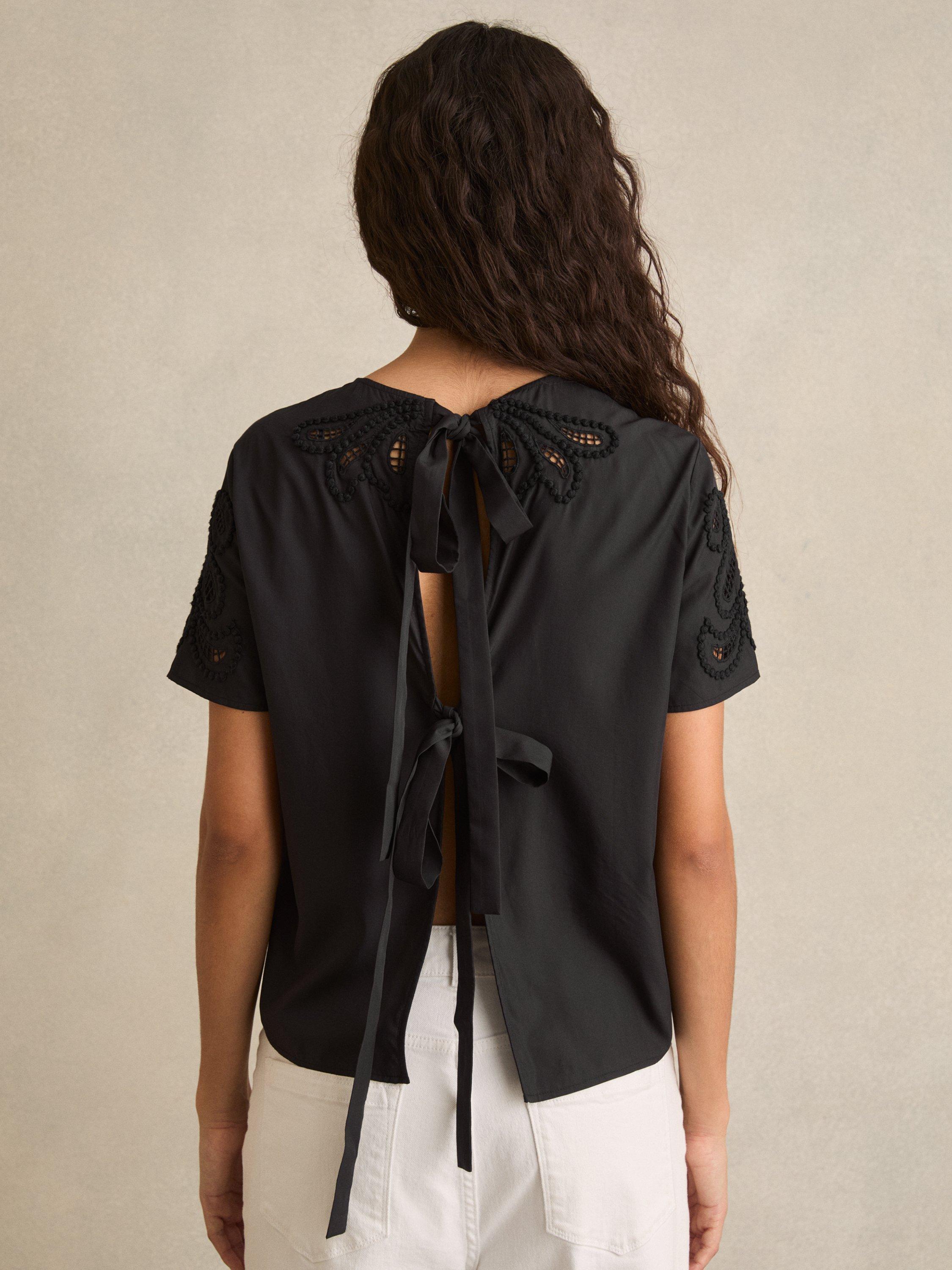 Product image 4 of 6, which shows Reiss Iyla Short Sleeve Floral Cut Out Embroidered Top, Black, 6