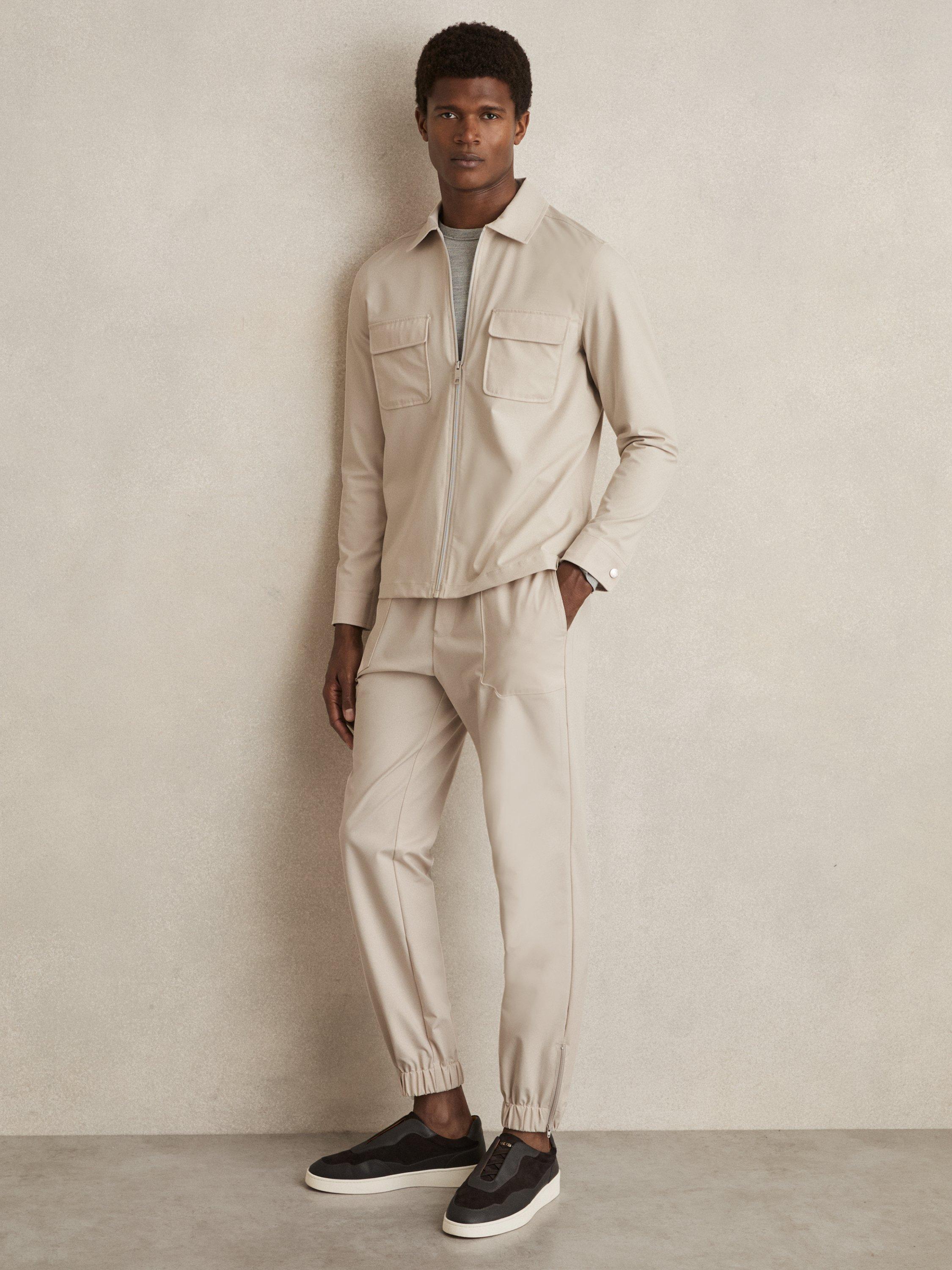 Product image 1 of 5, which shows Reiss Climb Elasticated Tapered Trousers, Stone, 28R
