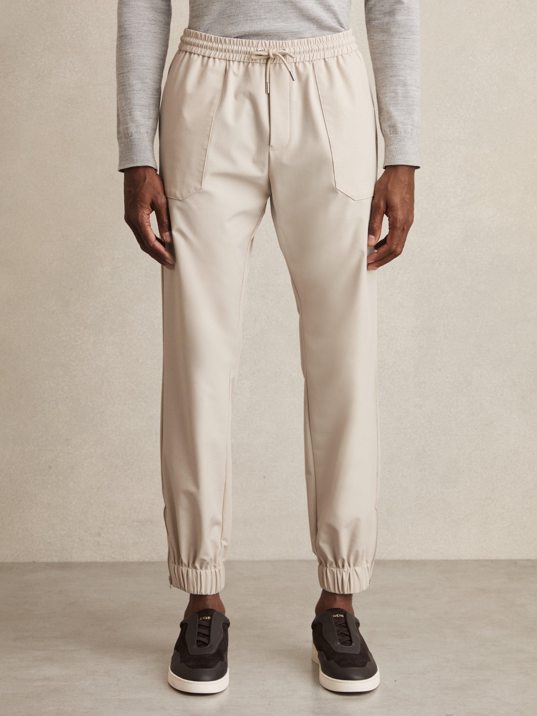 Product image 4 of 5, which shows Reiss Climb Elasticated Tapered Trousers, Stone, 28R