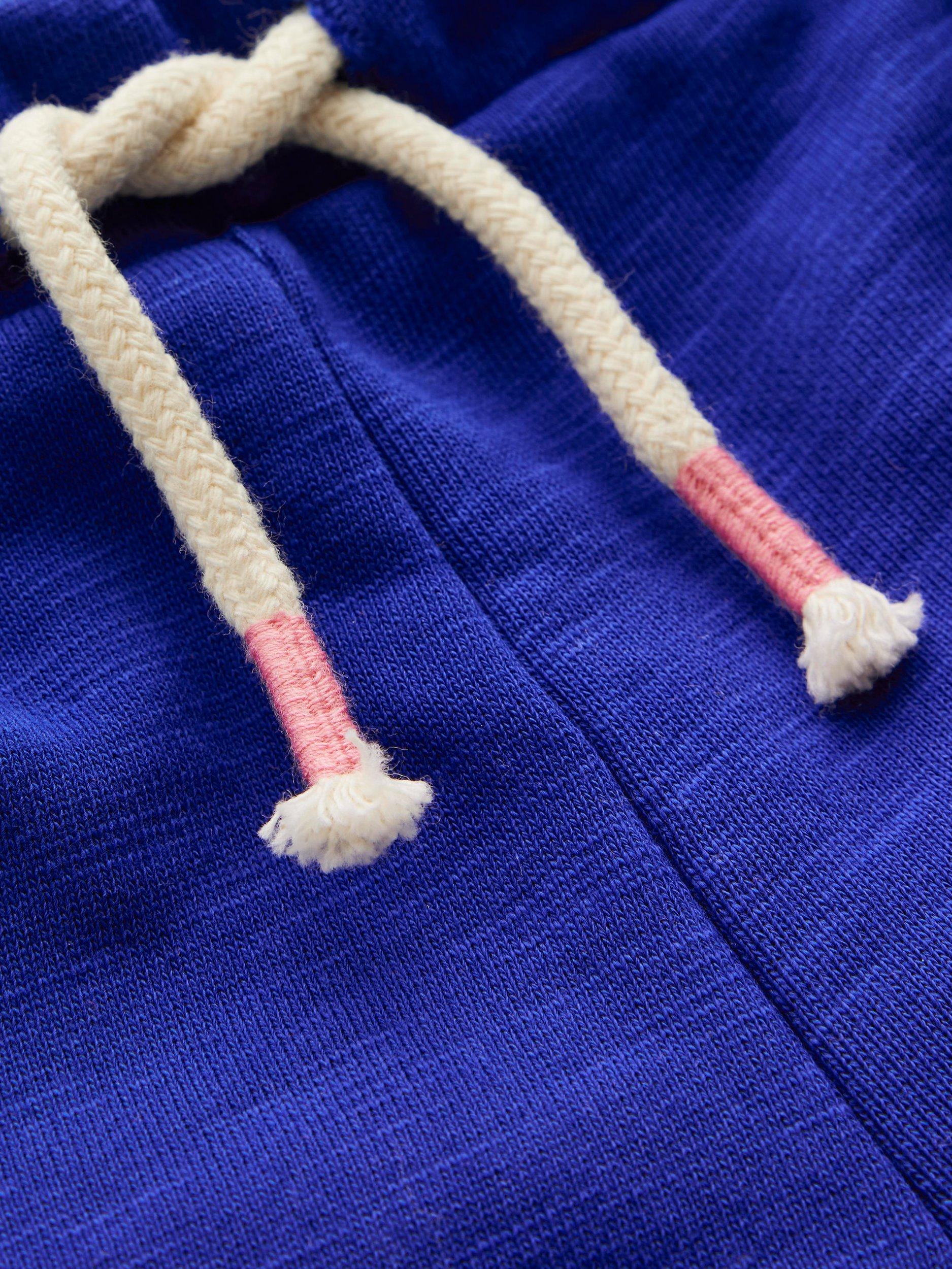 Product image 3 of 3, which shows Mini Boden Kids' Cotton Pom-Pom Trim Jersey Shorts, Bright Blue, 3-4 years