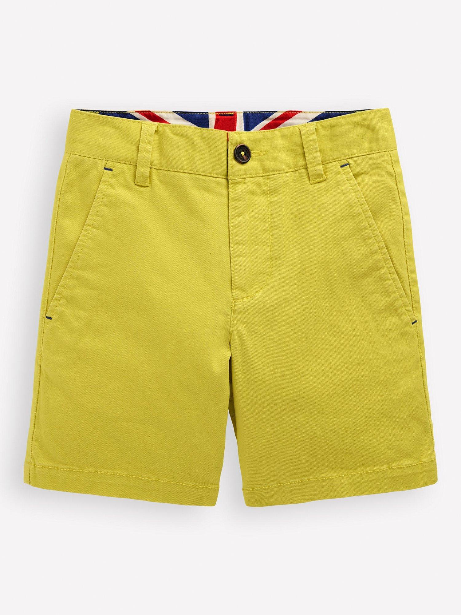 Product image 1 of 3, which shows Mini Boden Kids' Classic Chino Shorts, Pineapple Yellow, 5-6 years