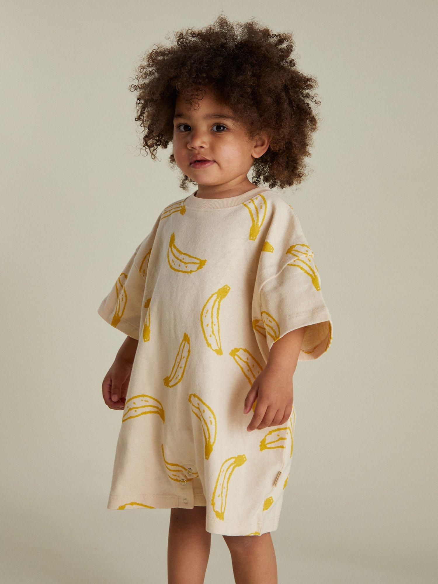 Product image 1 of 5, which shows Claude & Co Kids' Opal Cotton Banana Romper, Soft Cream, 3-6 months