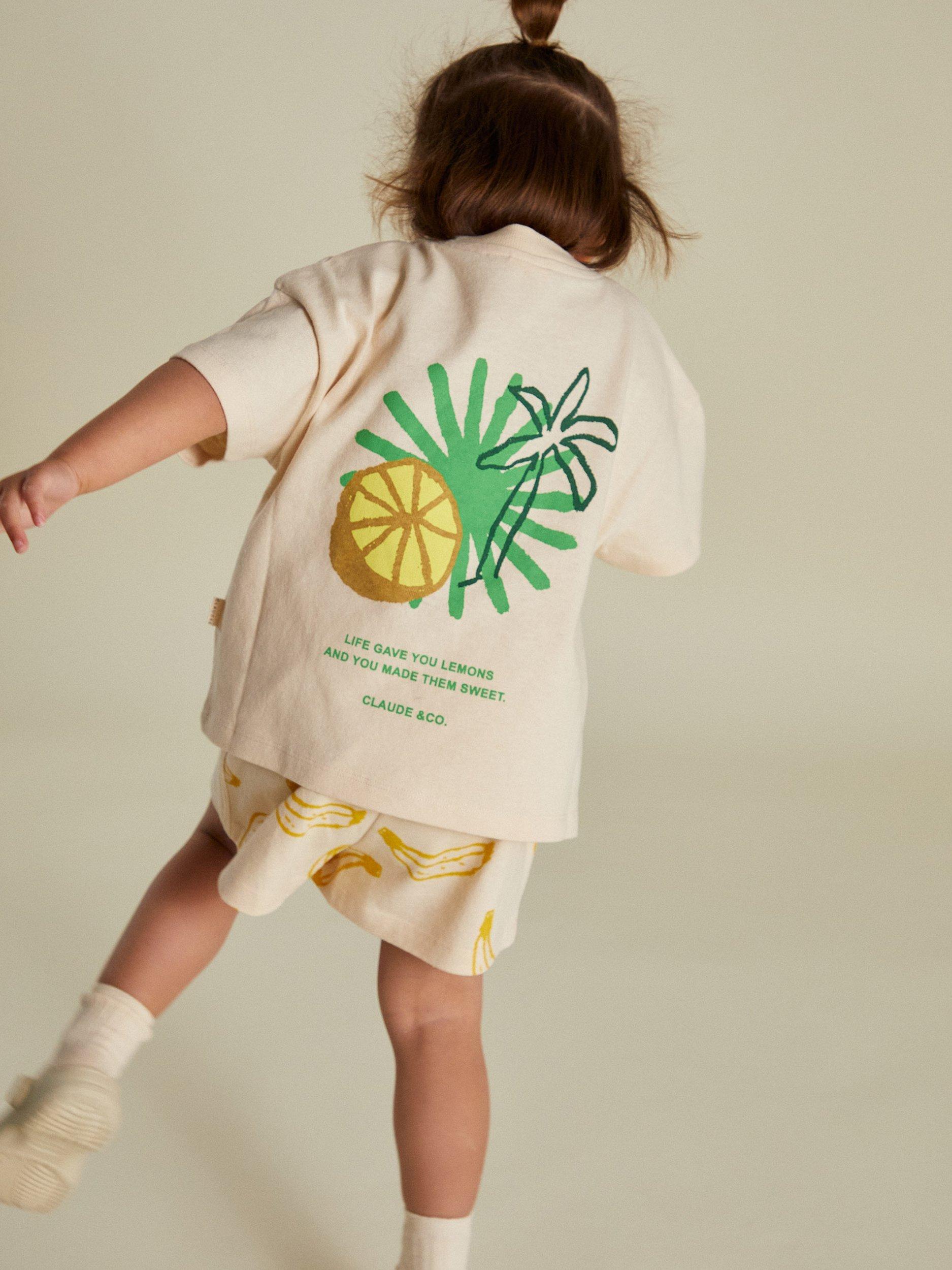 Product image 4 of 7, which shows Claude & Co Kids' Zuna Lemon Cotton T-Shirt, Soft Cream, 3-6 months