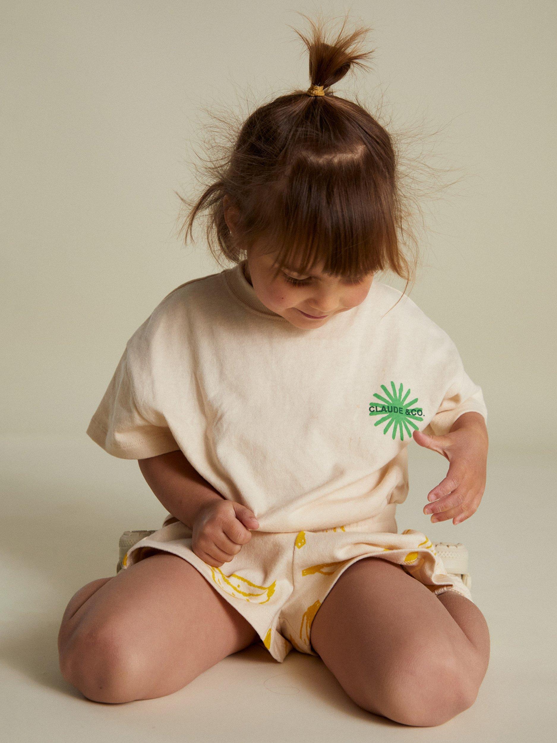 Product image 7 of 7, which shows Claude & Co Kids' Zuna Lemon Cotton T-Shirt, Soft Cream, 3-6 months