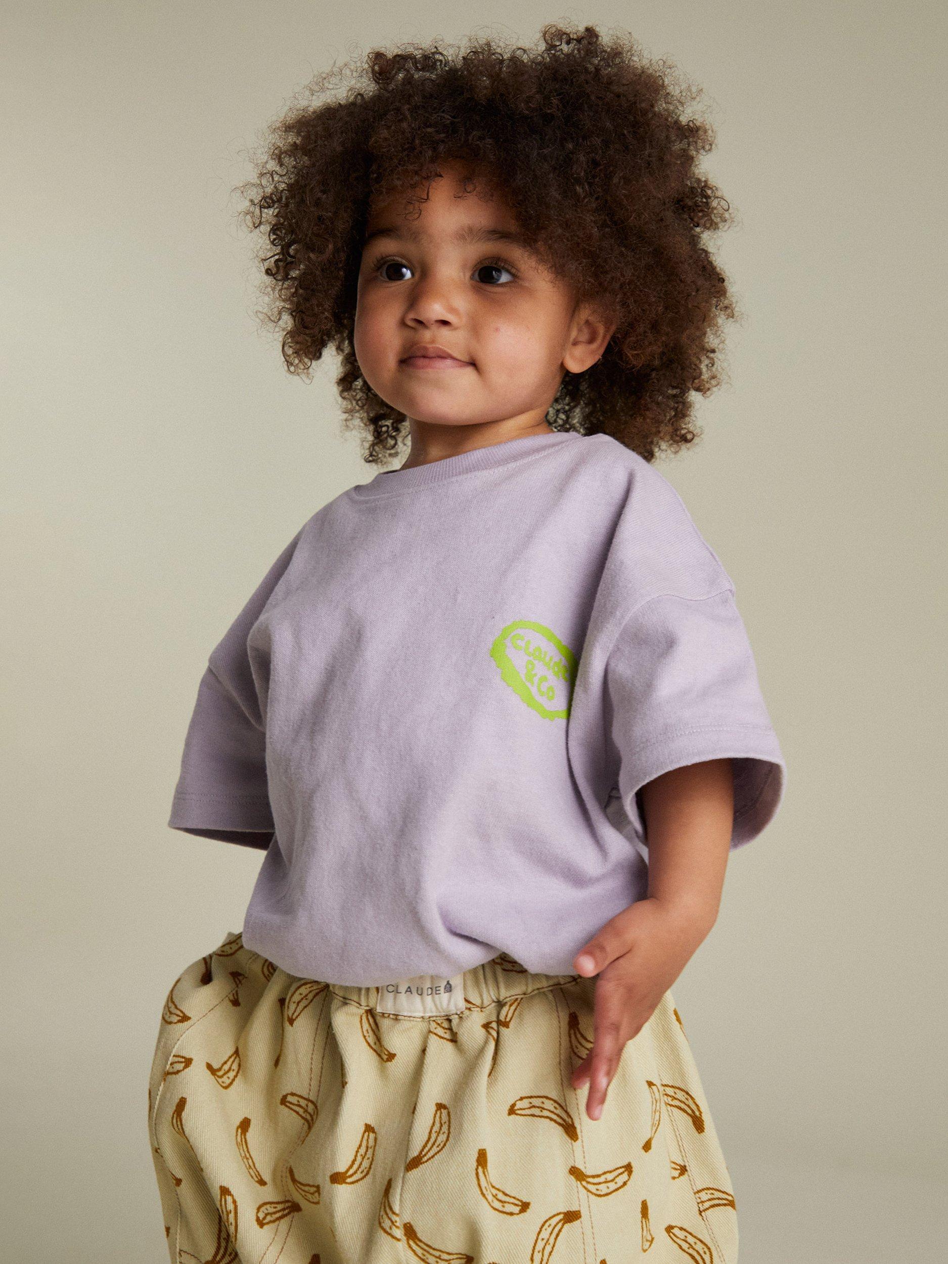 Product image 6 of 7, which shows Claude & Co  Kids' Edie Cotton Fruit Print T-Shirt, Lilac, 6-12 months