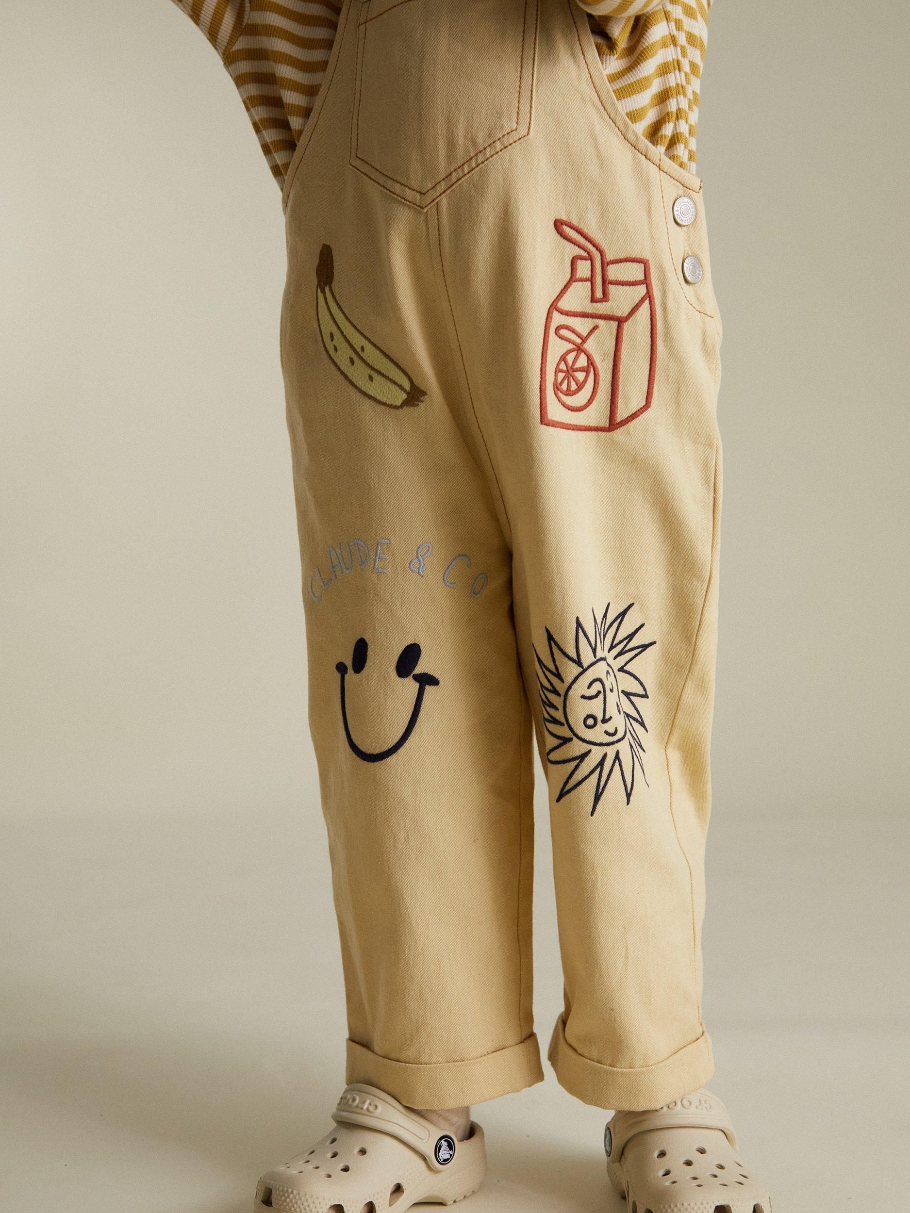 Product image 2 of 6, which shows Claude & Co Kids' Piper Breakfast Cotton Dungarees, Lemon, 6-12 months