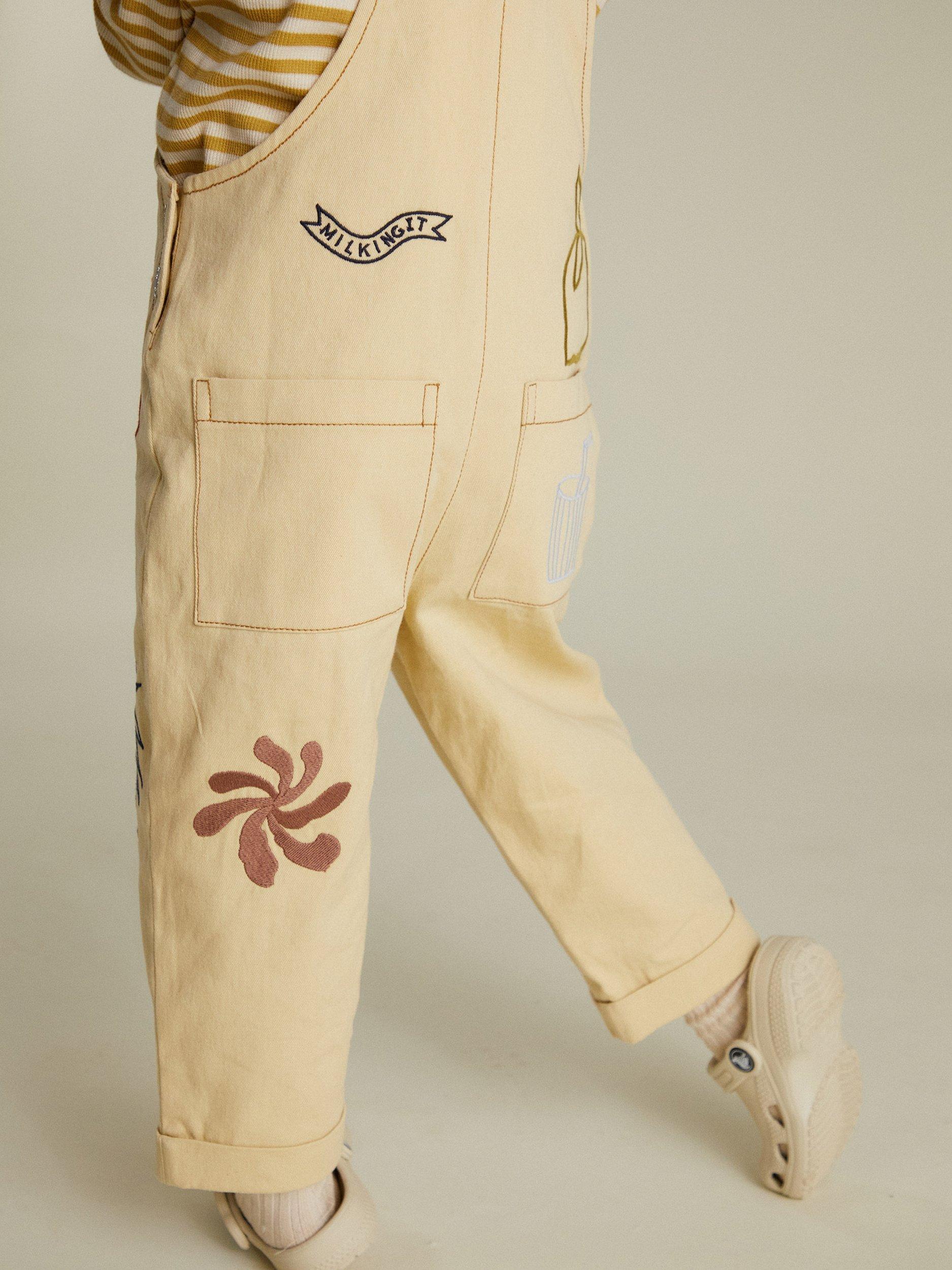 Product image 4 of 6, which shows Claude & Co Kids' Piper Breakfast Cotton Dungarees, Lemon, 6-12 months