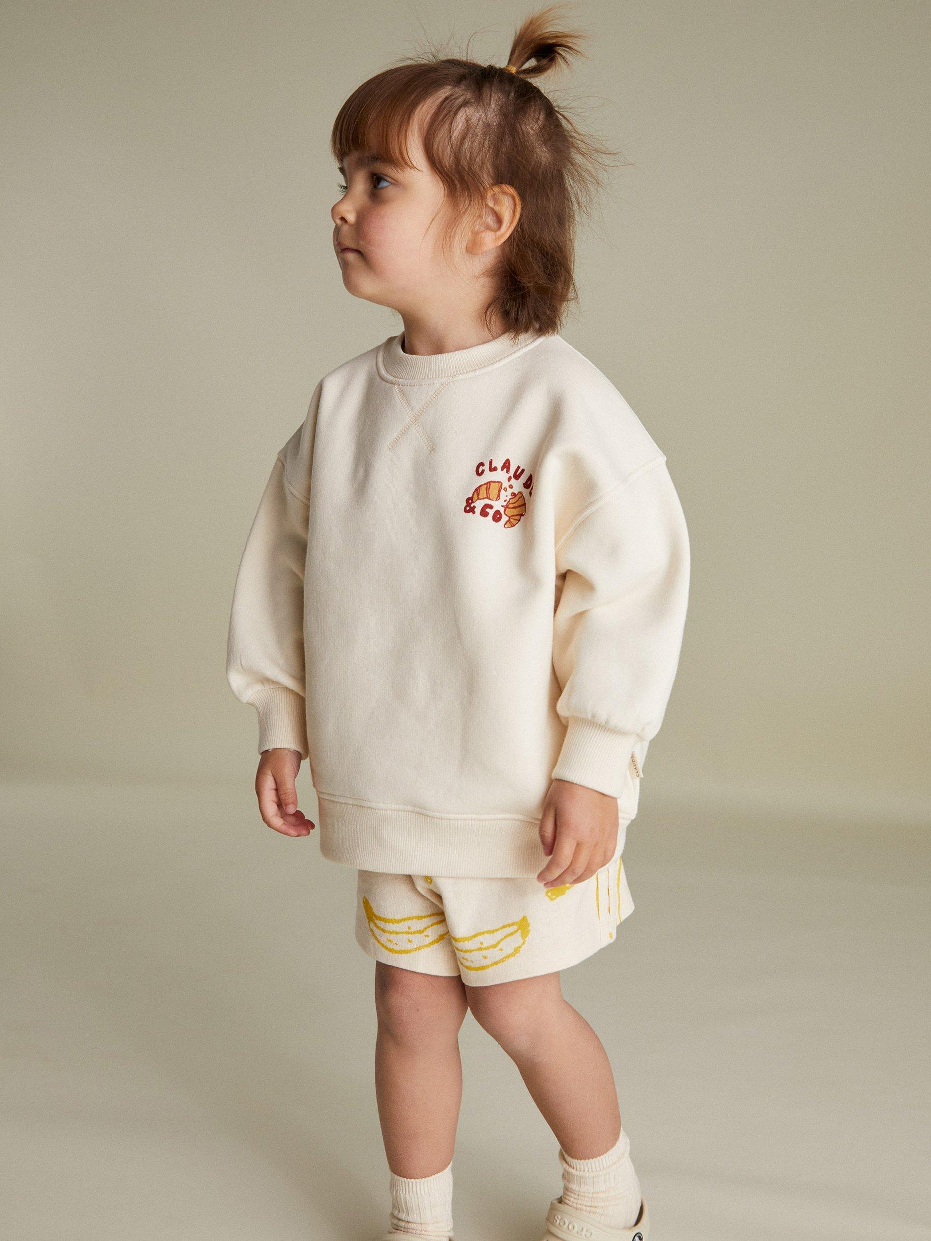 Product image 4 of 4, which shows Claude & Co Kids' Jammy Picnic Relaxed Sweater, Soft Cream, 6-12 months