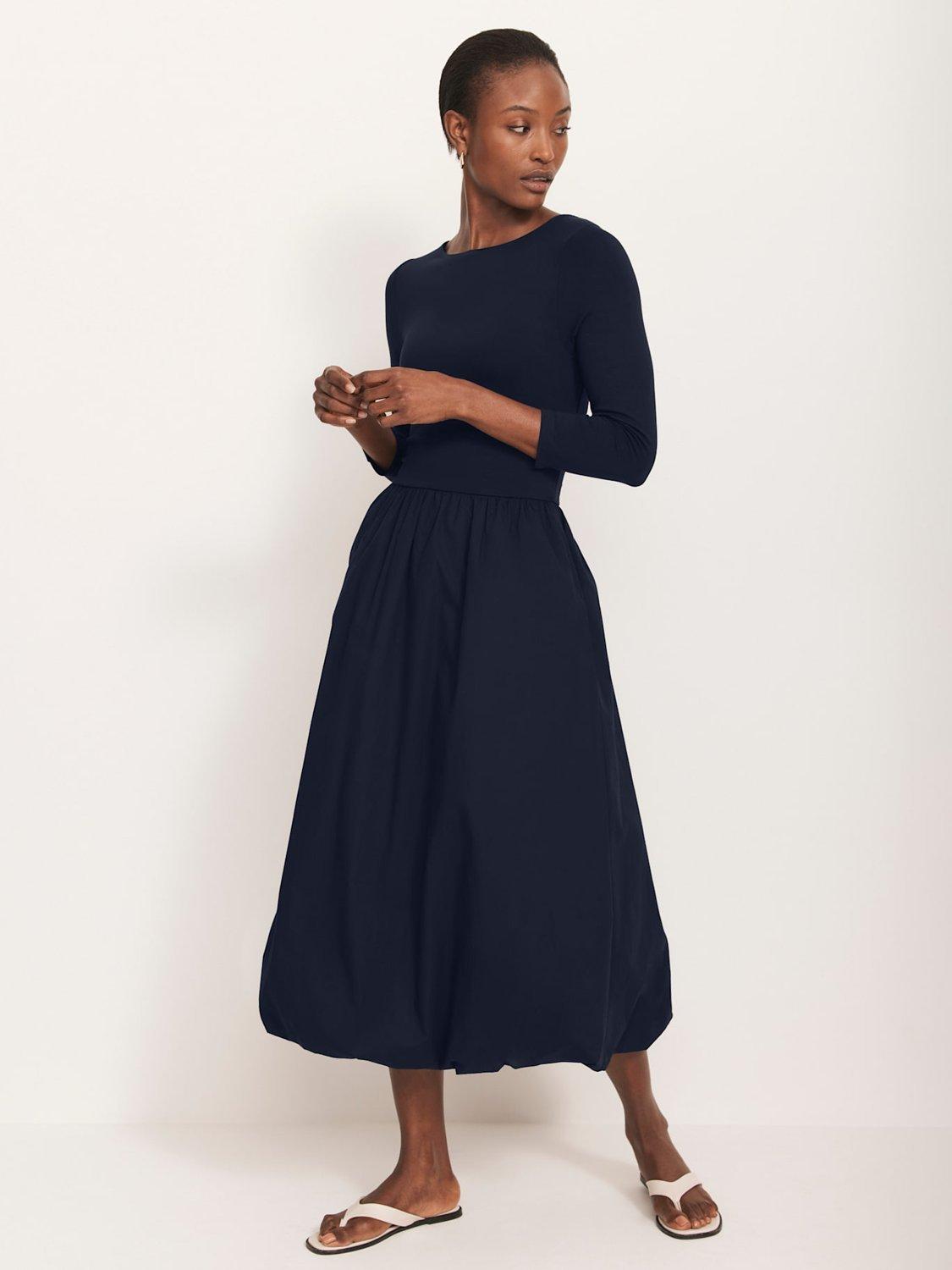 Model waering navy blue bubble hem midi dress