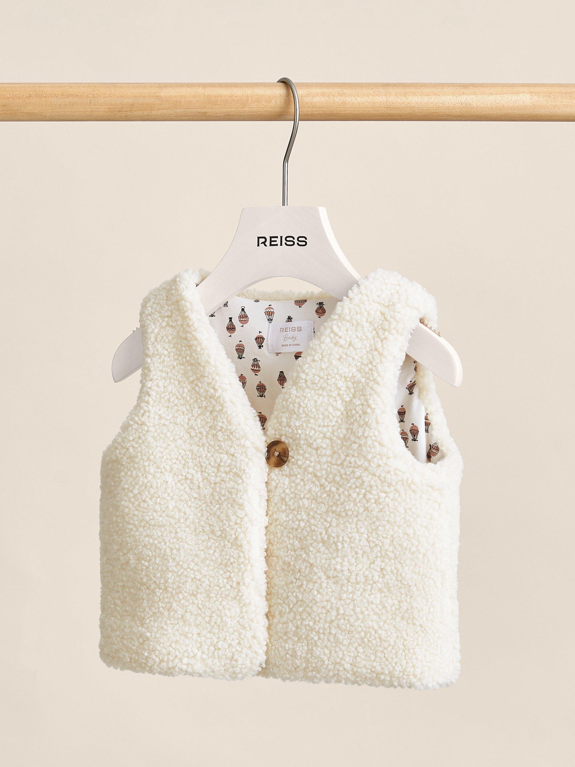 Product image 1 of 4, which shows Reiss Baby Shai Lined Fleece Gilet, Ivory, 0-3 months