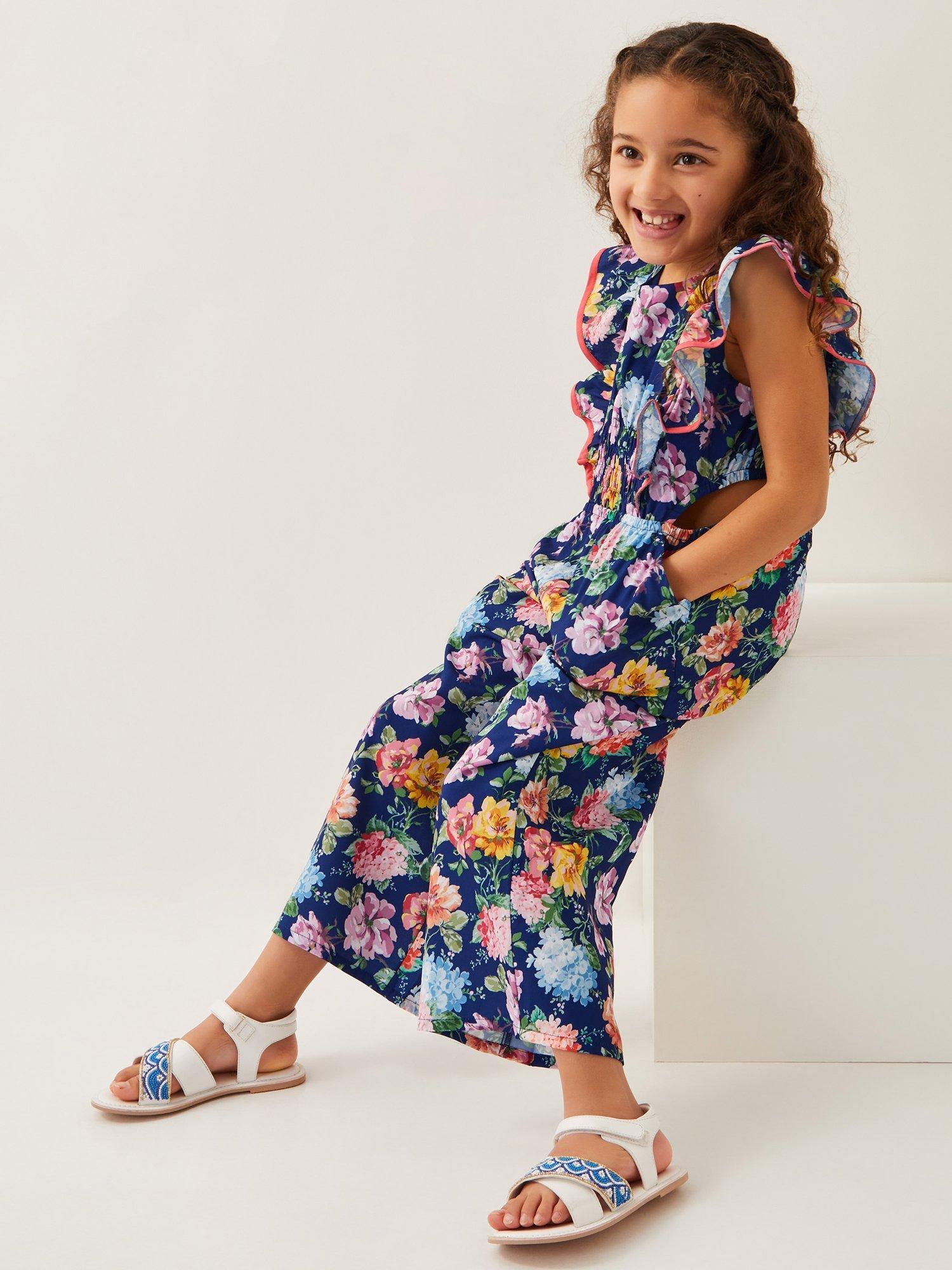 Product image 1 of 4, which shows Monsoon Kids' Floral Print Jumpsuit, Navy, 3 years
