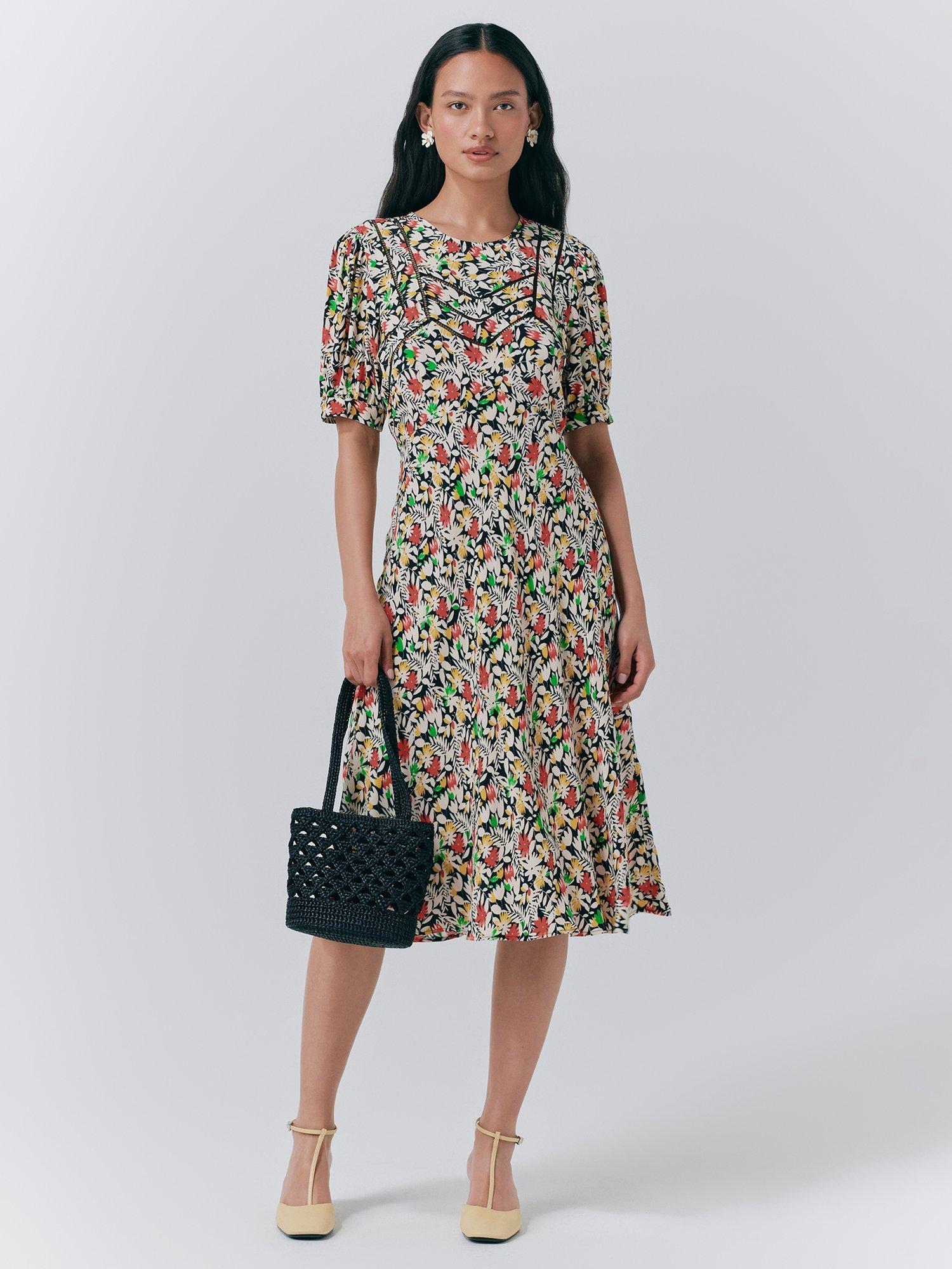Product image 1 of 5, which shows Ghost Dotty Puff Sleeve Floral Dress, Black/Multi, XS
